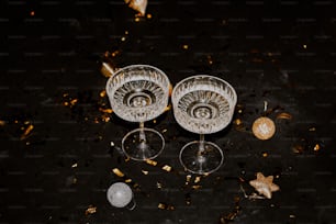 a couple of wine glasses sitting on top of a table