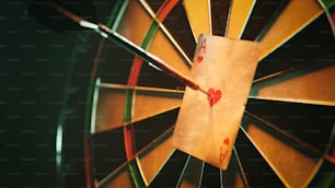 a close up of a dart with a card on it