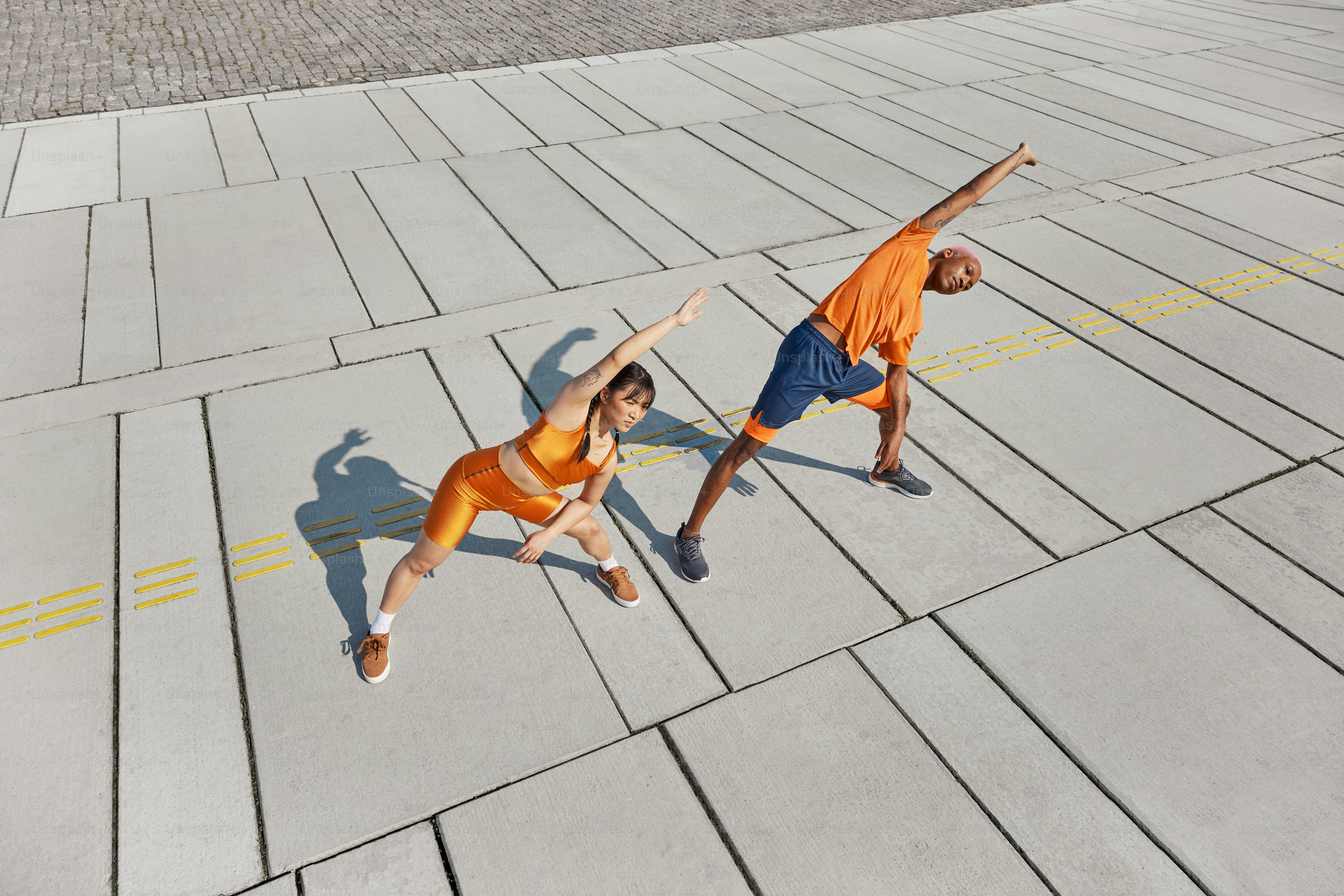 a couple of people that are standing in the street