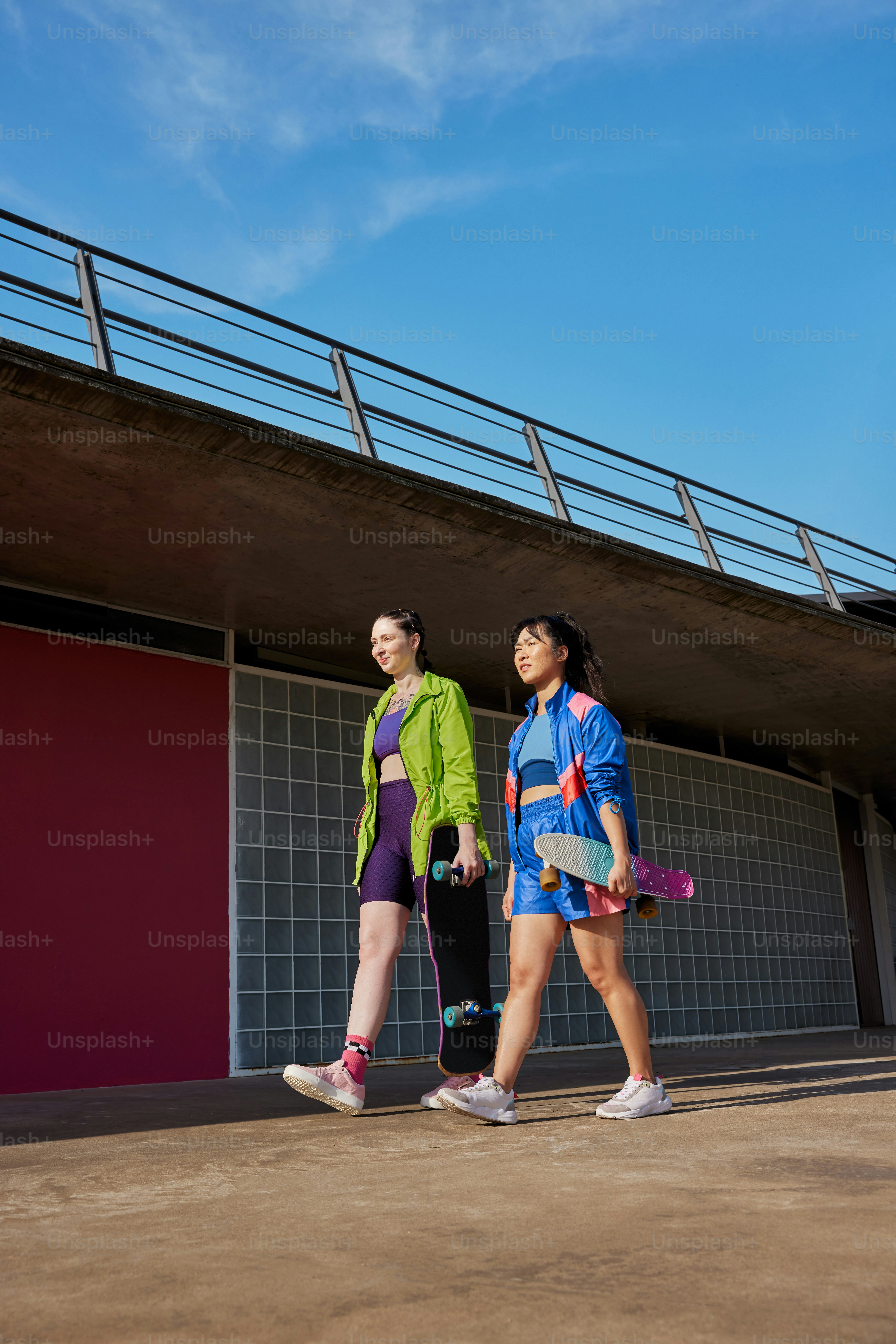 a couple of women walking next to each other