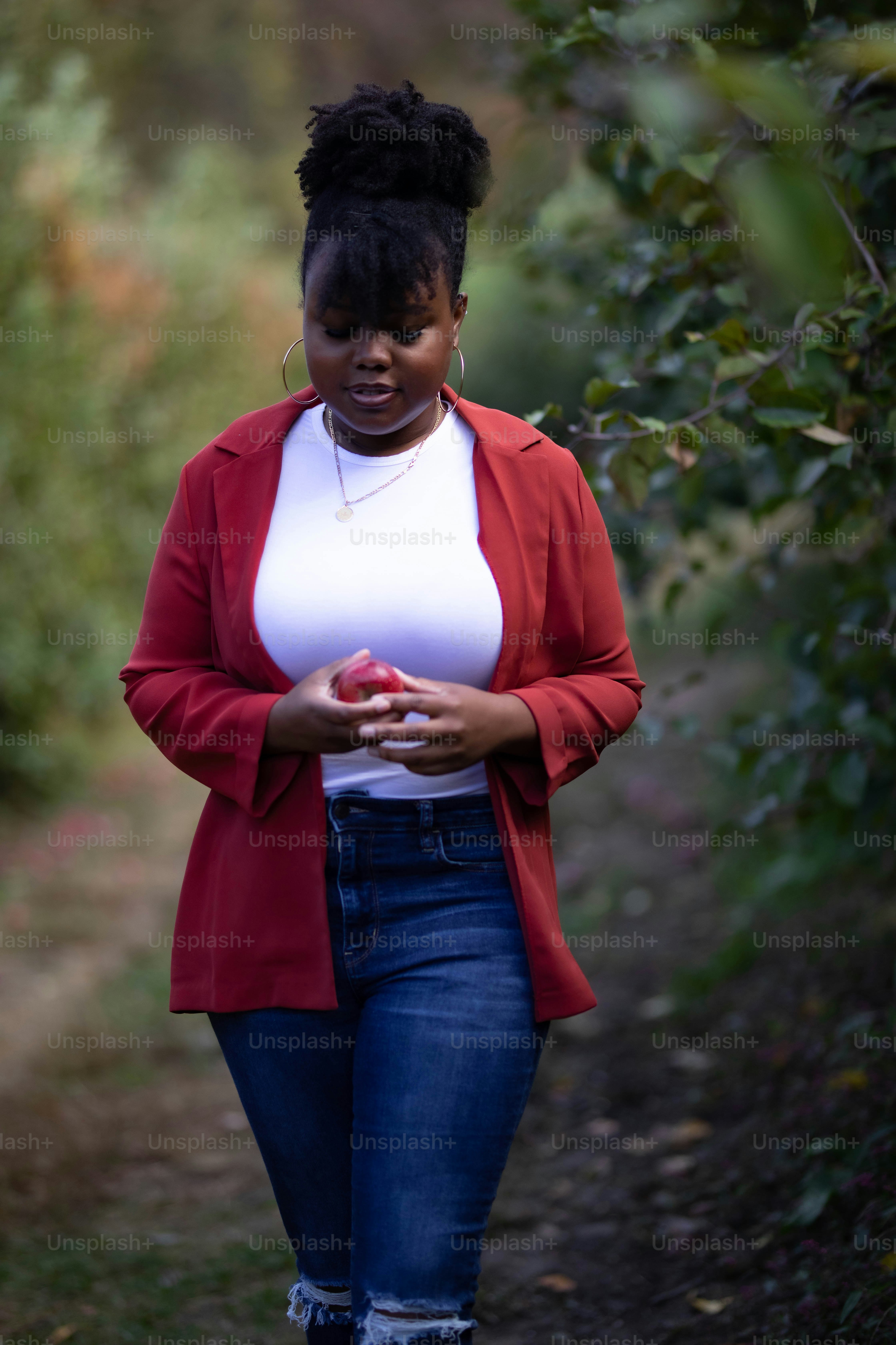 A woman in a red jacket is posing for a picture photo – Girl wallpaper ...
