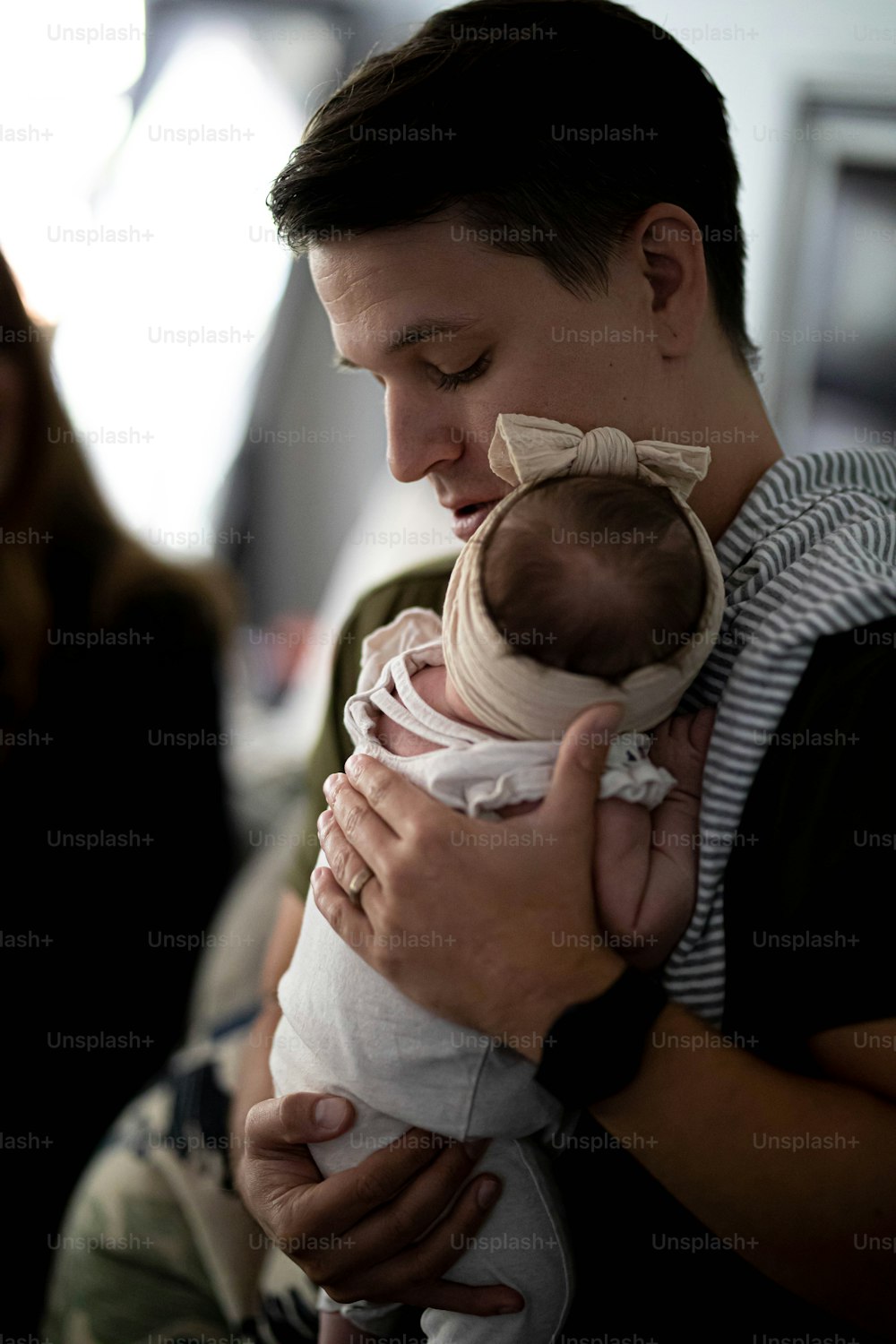 a man holding a baby in his arms