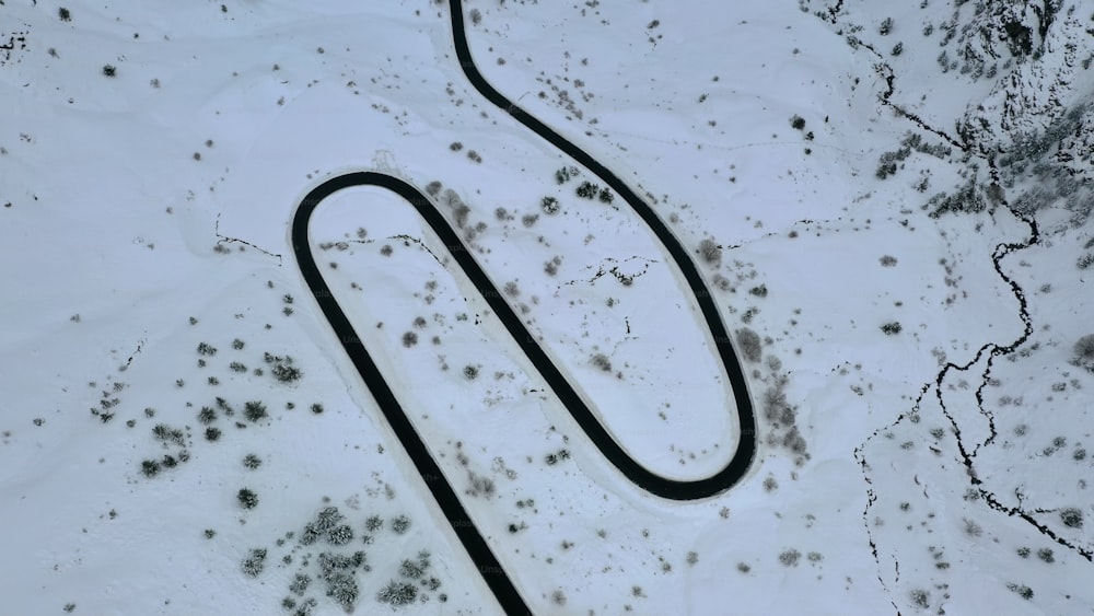 a snow covered ski slope with a long tube