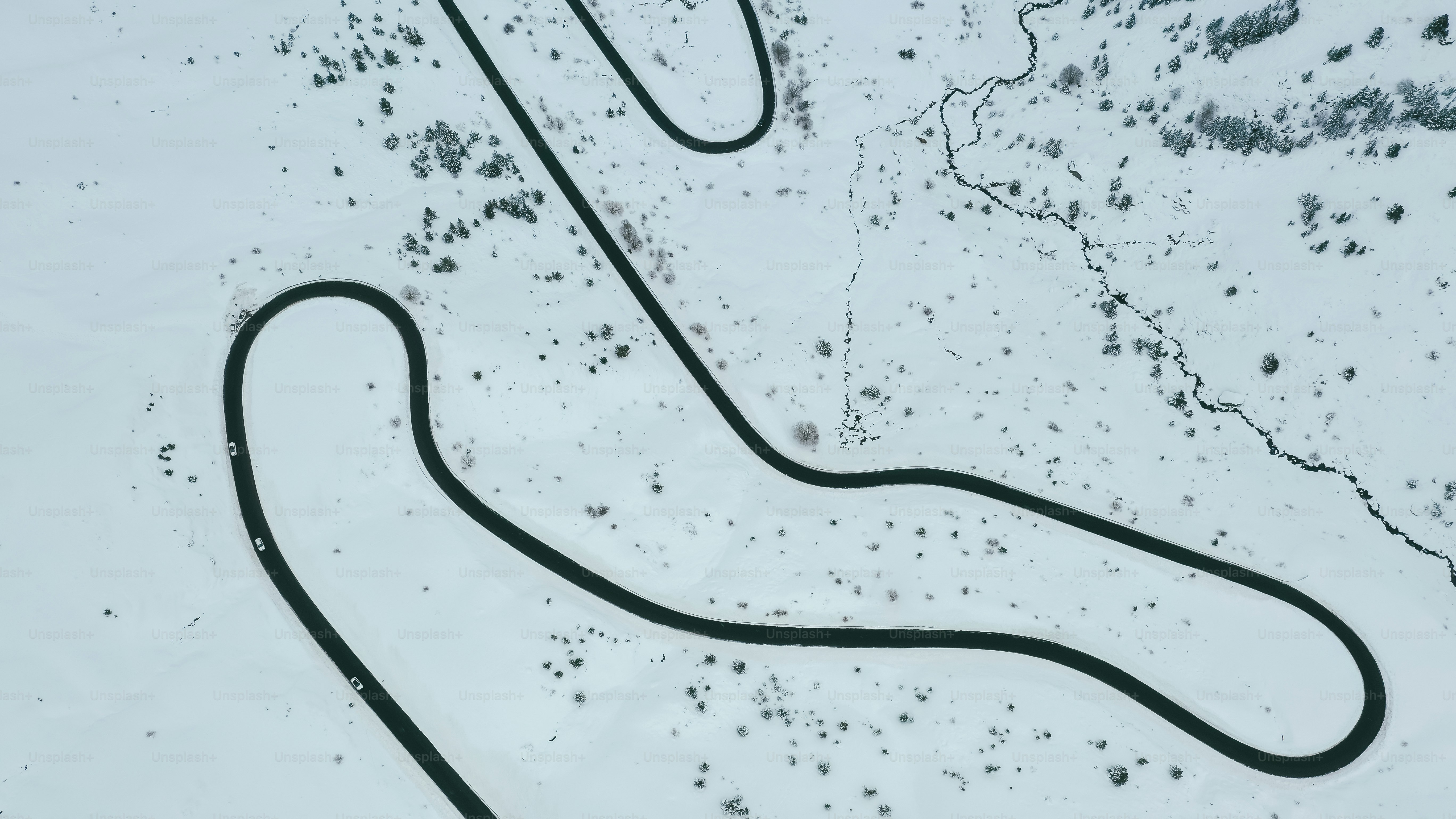 a long winding road in the snow