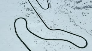 a long winding road in the snow
