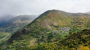 a view of a mountain with a village in the distance