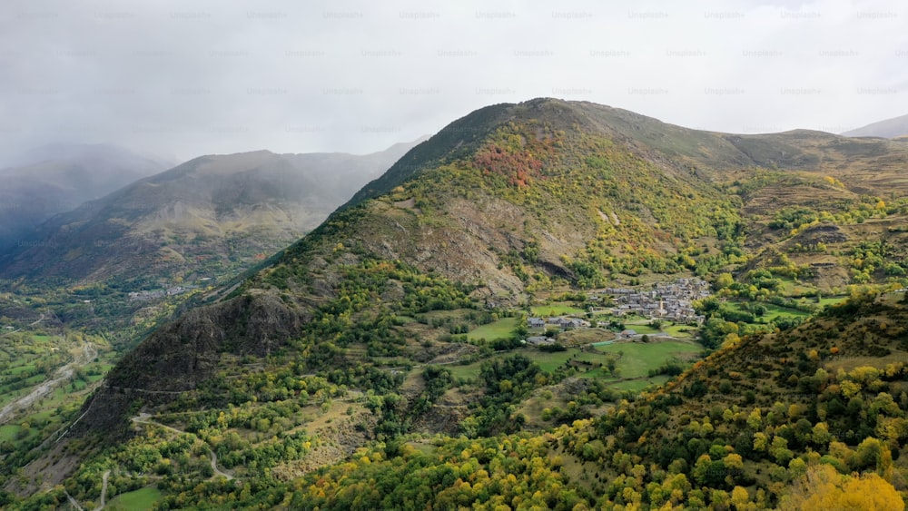 a view of a mountain with a village in the distance