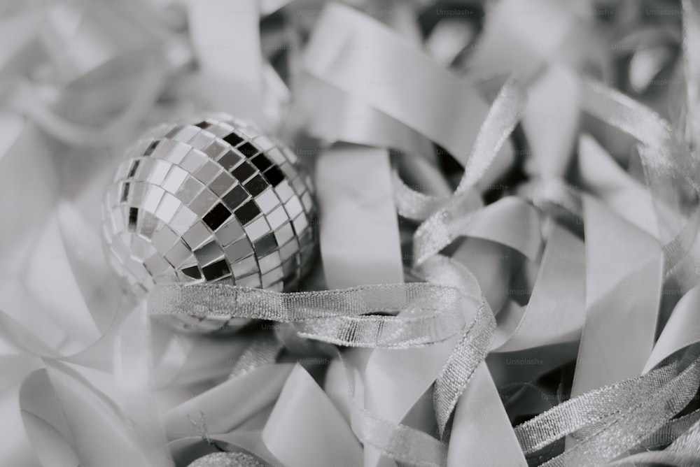 a disco ball surrounded by ribbons and streamers