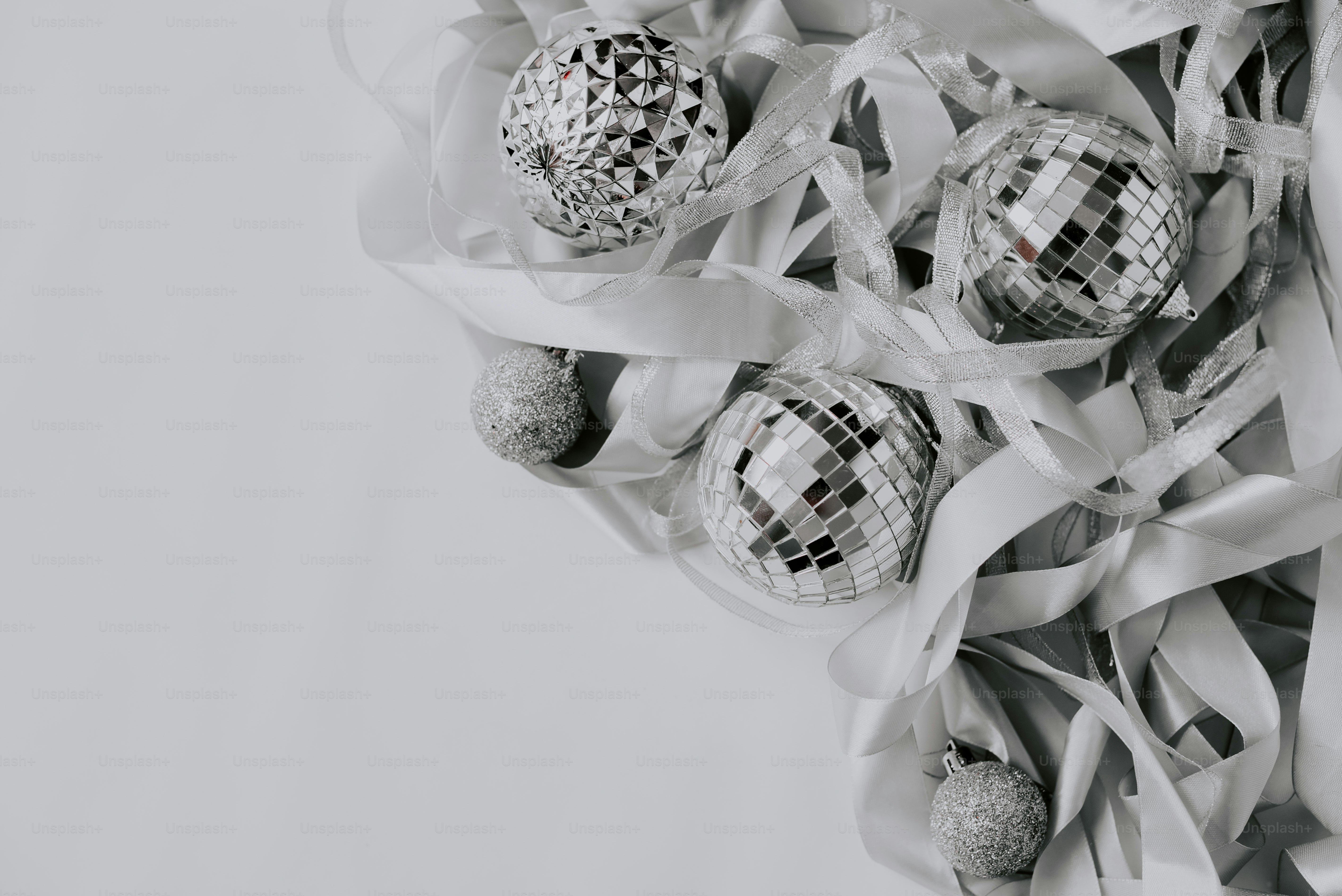 a group of disco balls sitting on top of ribbons