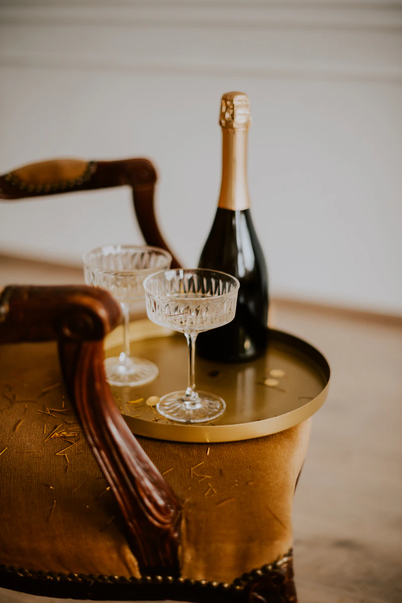 A champagne sabre and a bottle prepared for ceremonial opening