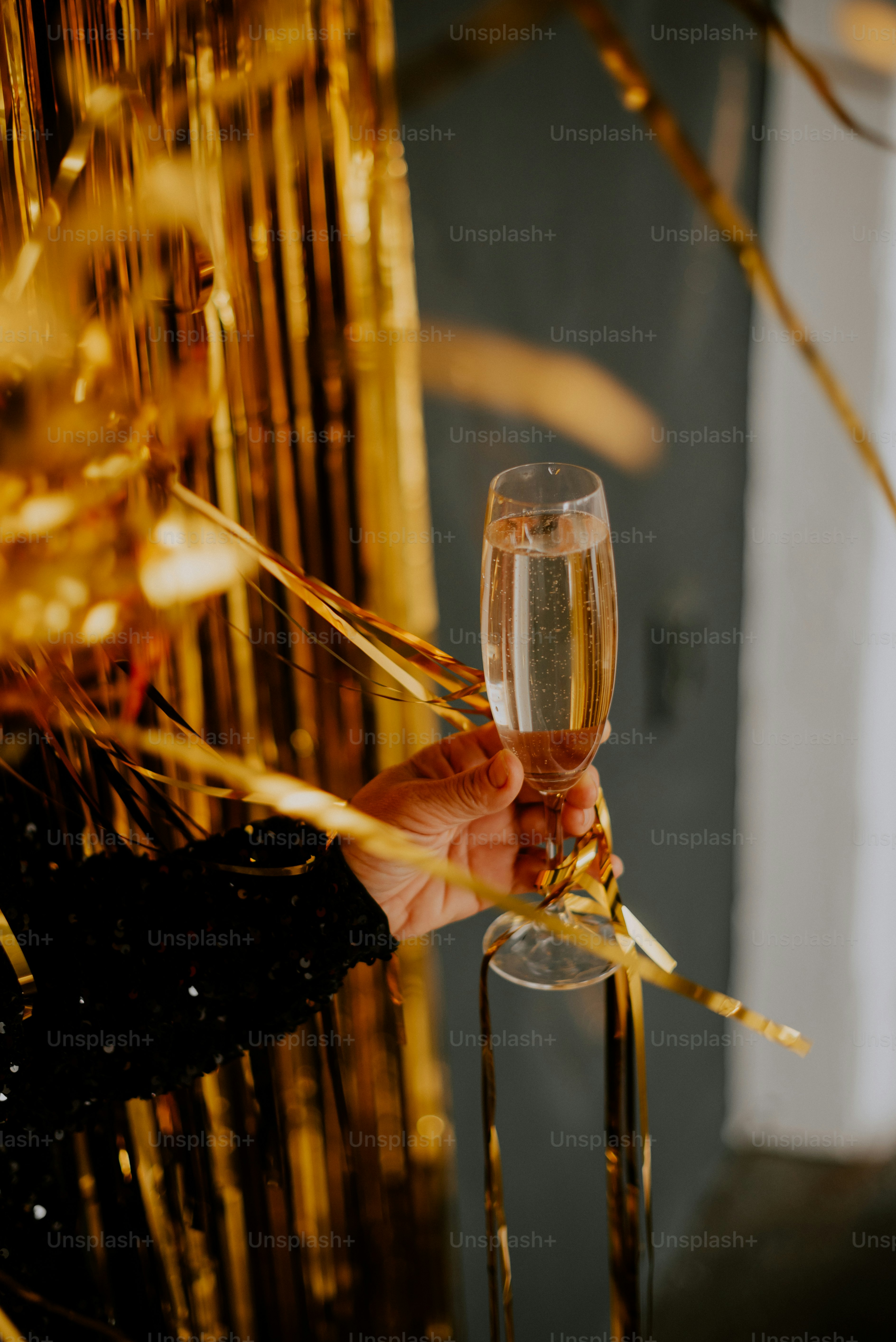 a person holding a wine glass in their hand