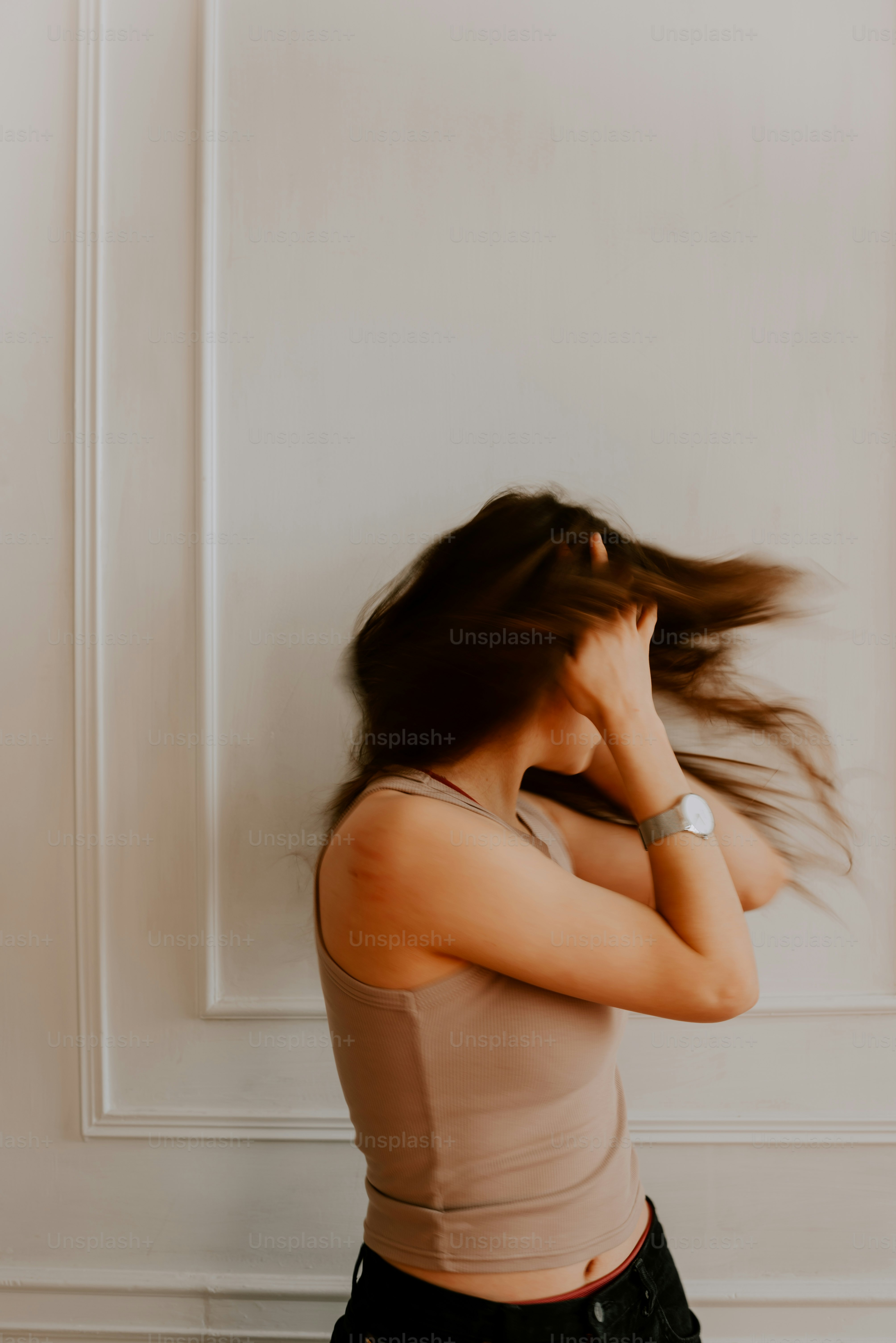 a woman with her hair blowing in the wind