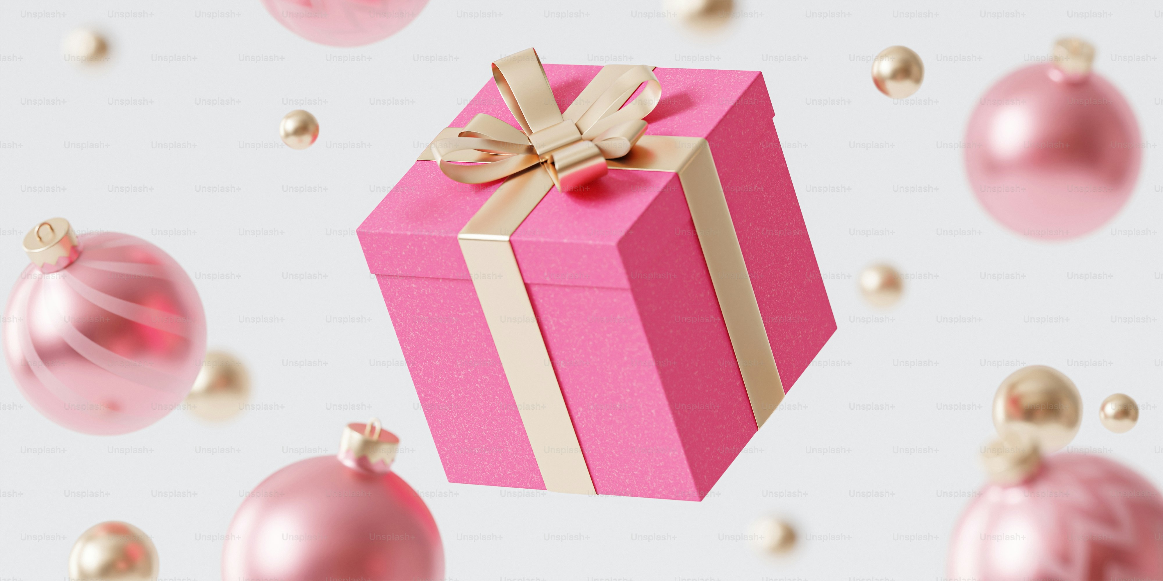 A pink gift box with a gold ribbon and a bow photo – Background Image ...