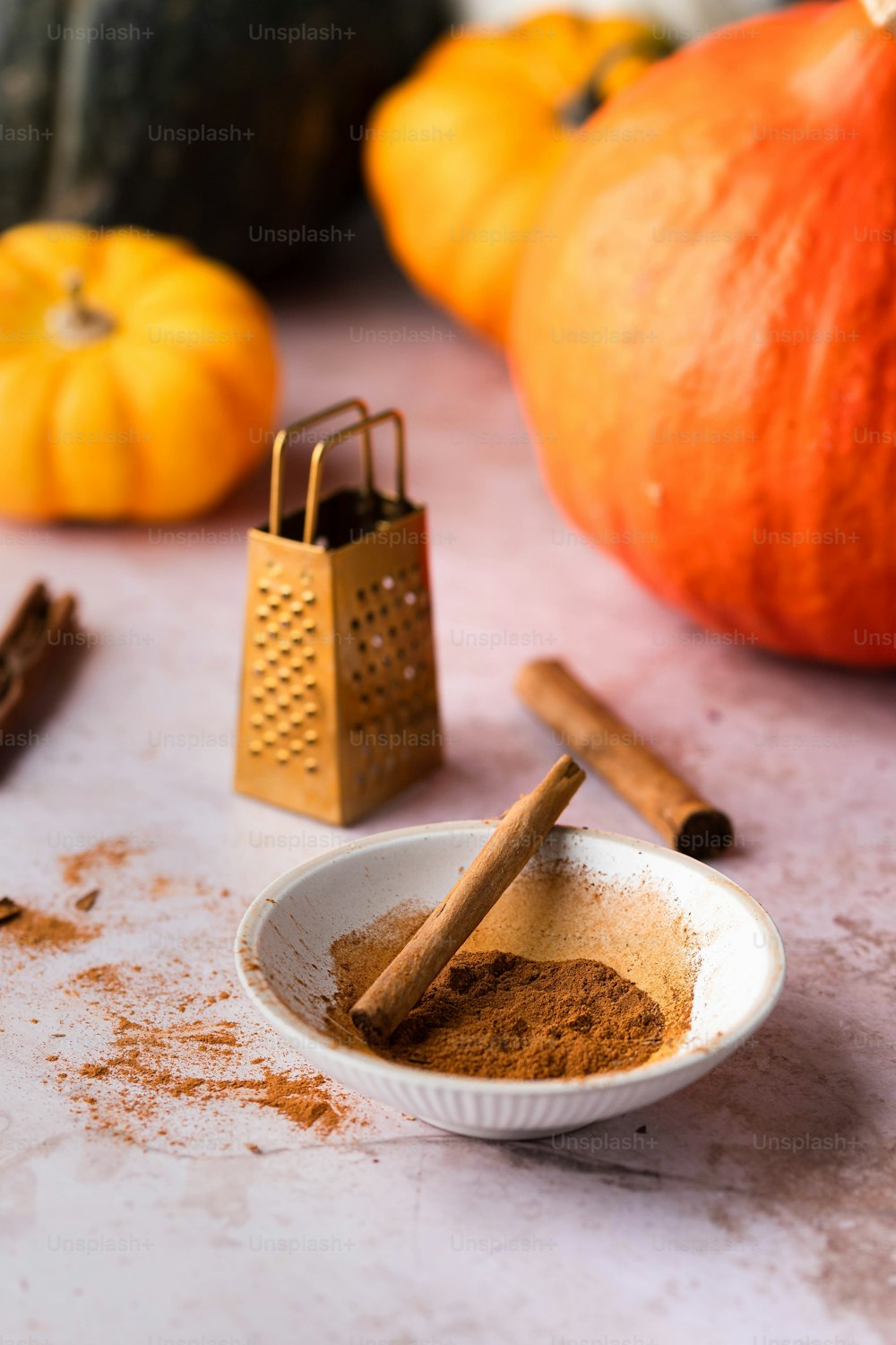 a white bowl filled with cinnamon and spices