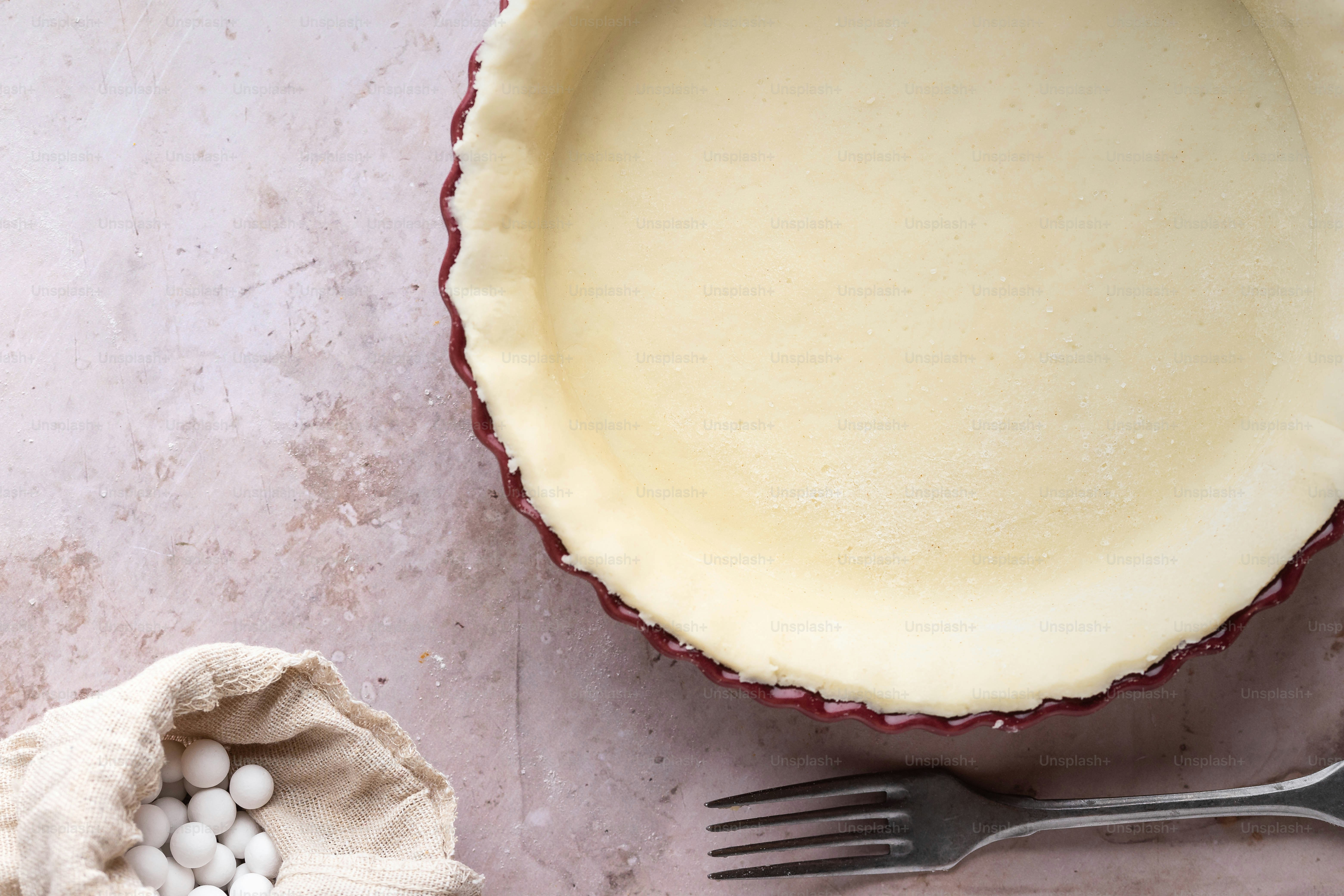 a pie pan and a fork on a table