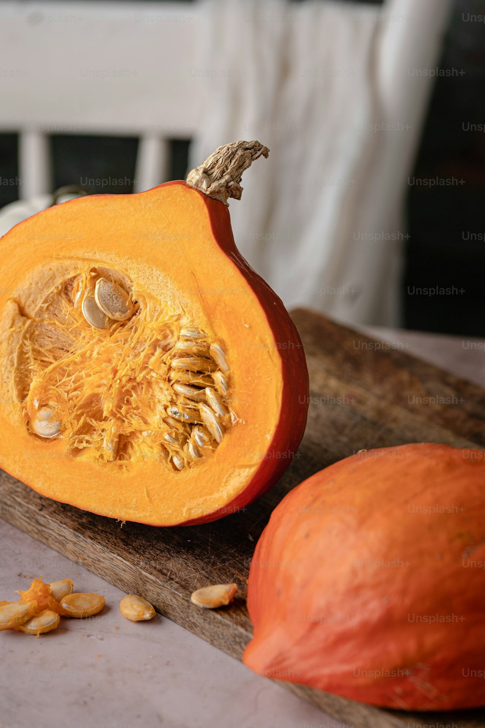a close up of a pumpkin on a cutting board