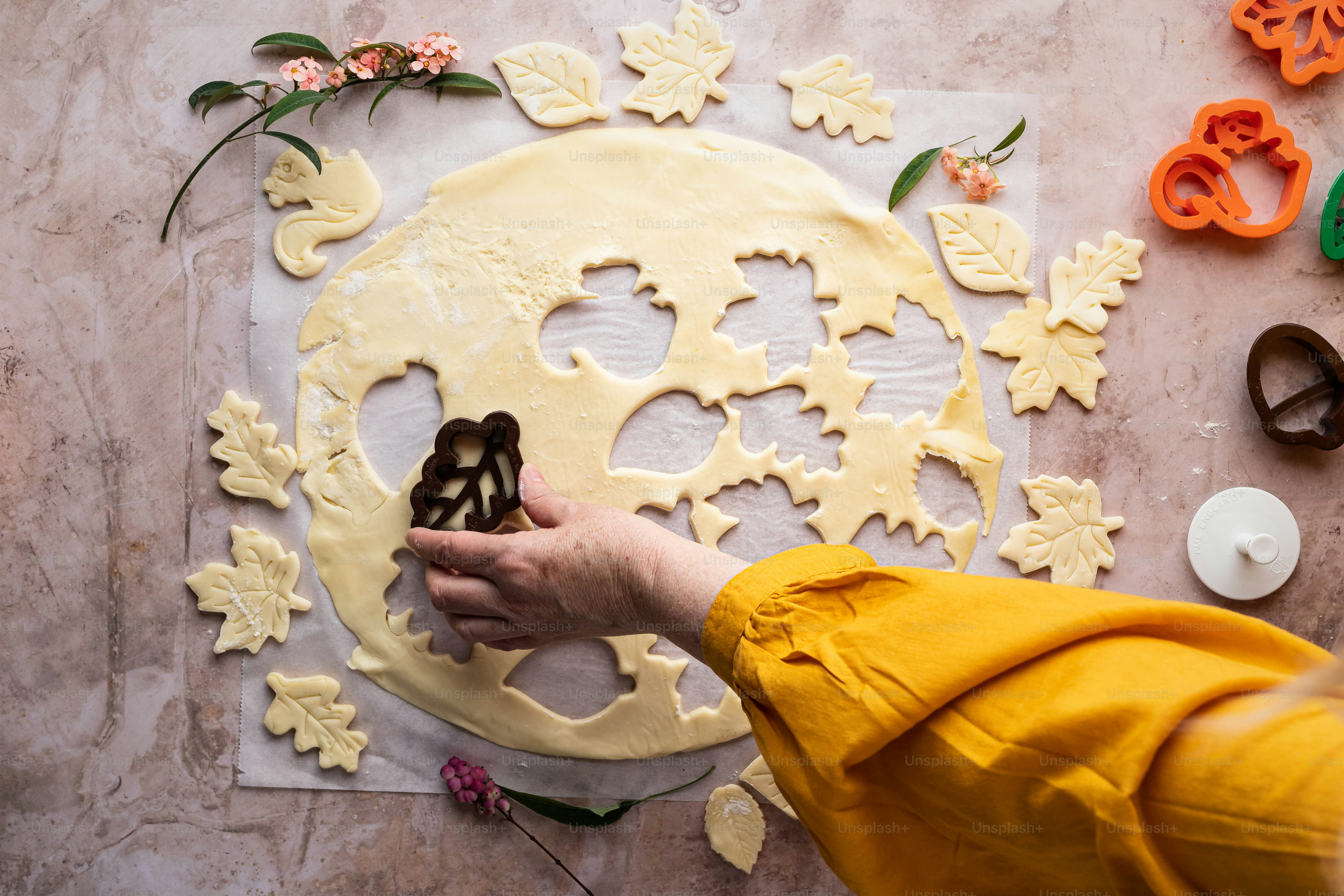 a person holding a cookie in their hand