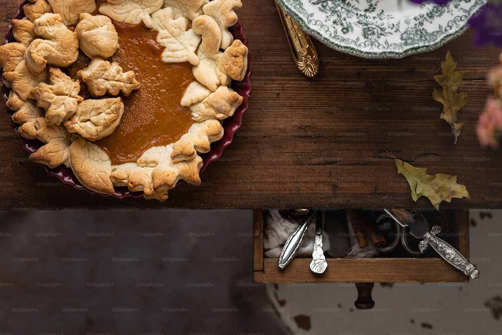 a pie sitting on top of a wooden table