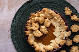 a pie on a plate with some pieces of pie in the middle
