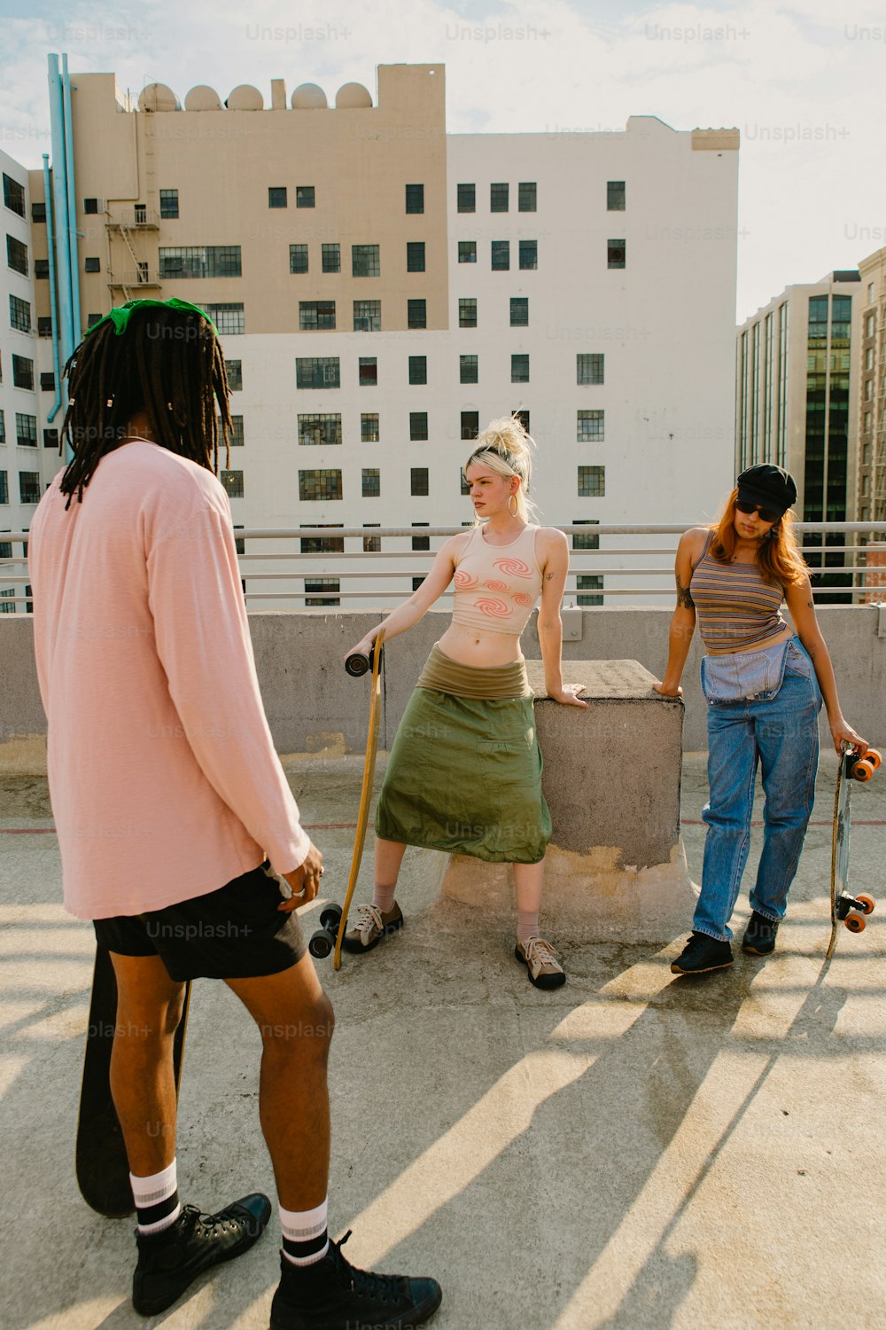 a group of people with skateboards and walking sticks