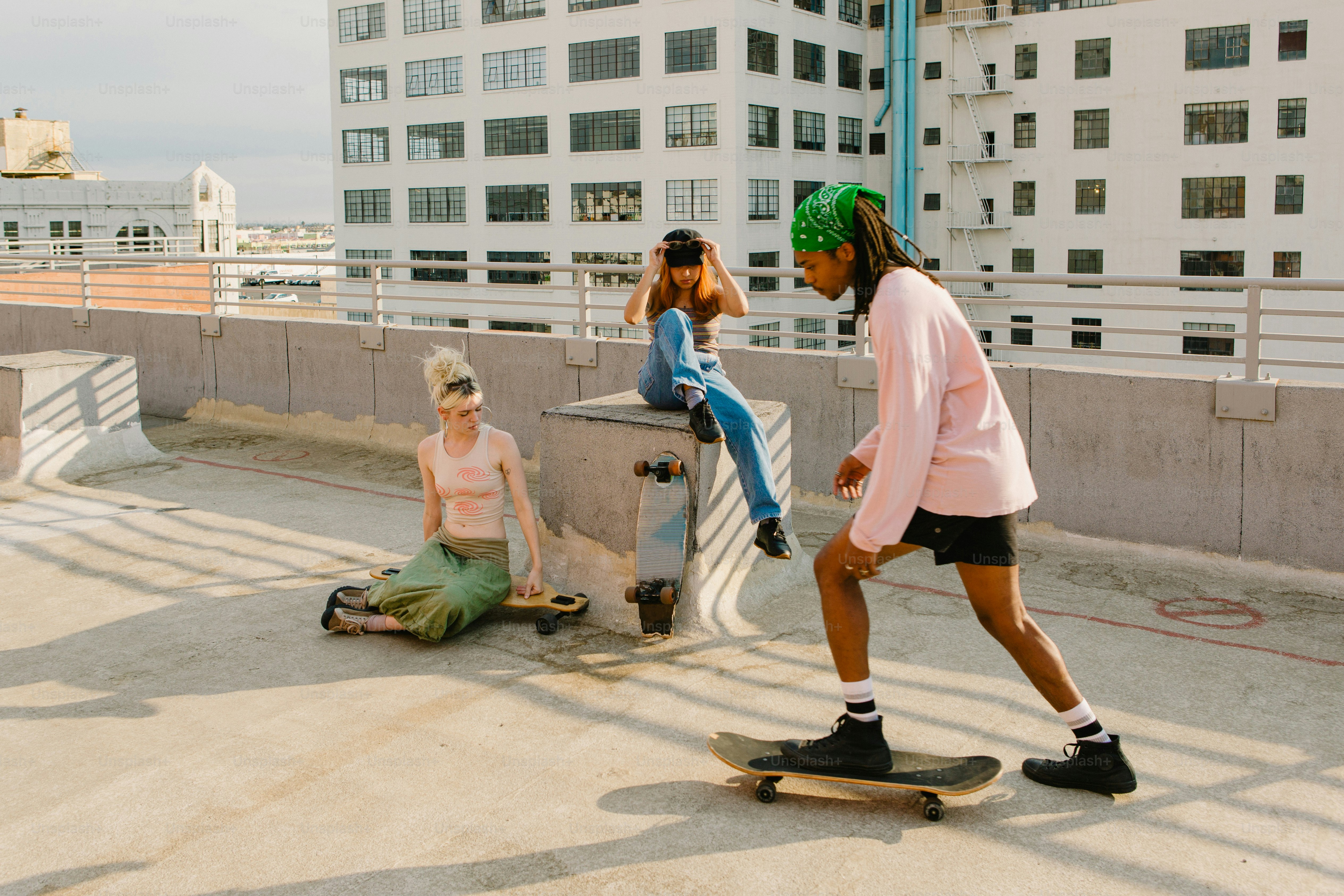 a couple of people that are on a skateboard