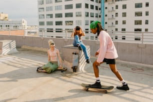a couple of people that are on a skateboard