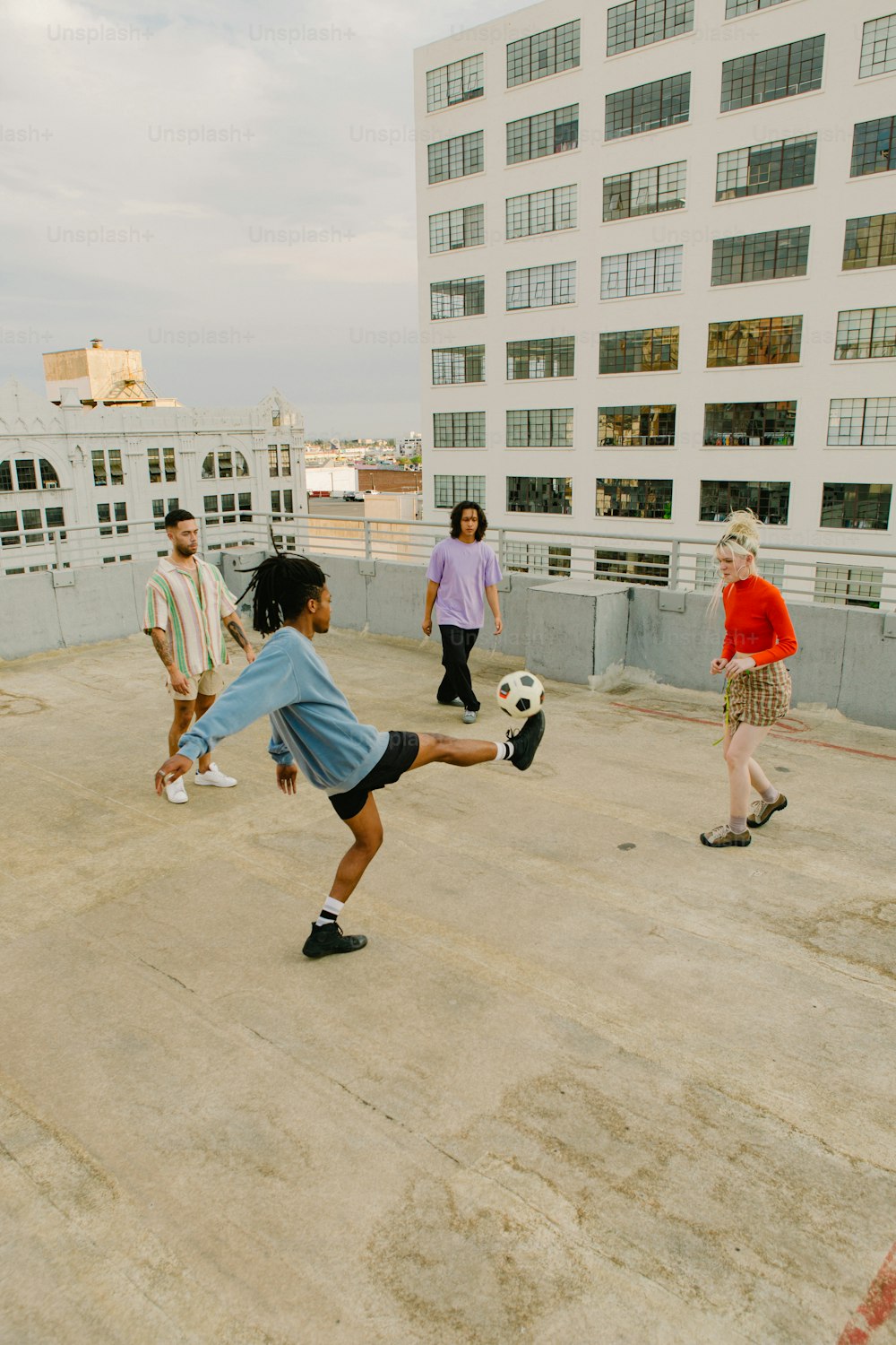 a group of young people playing a game of soccer