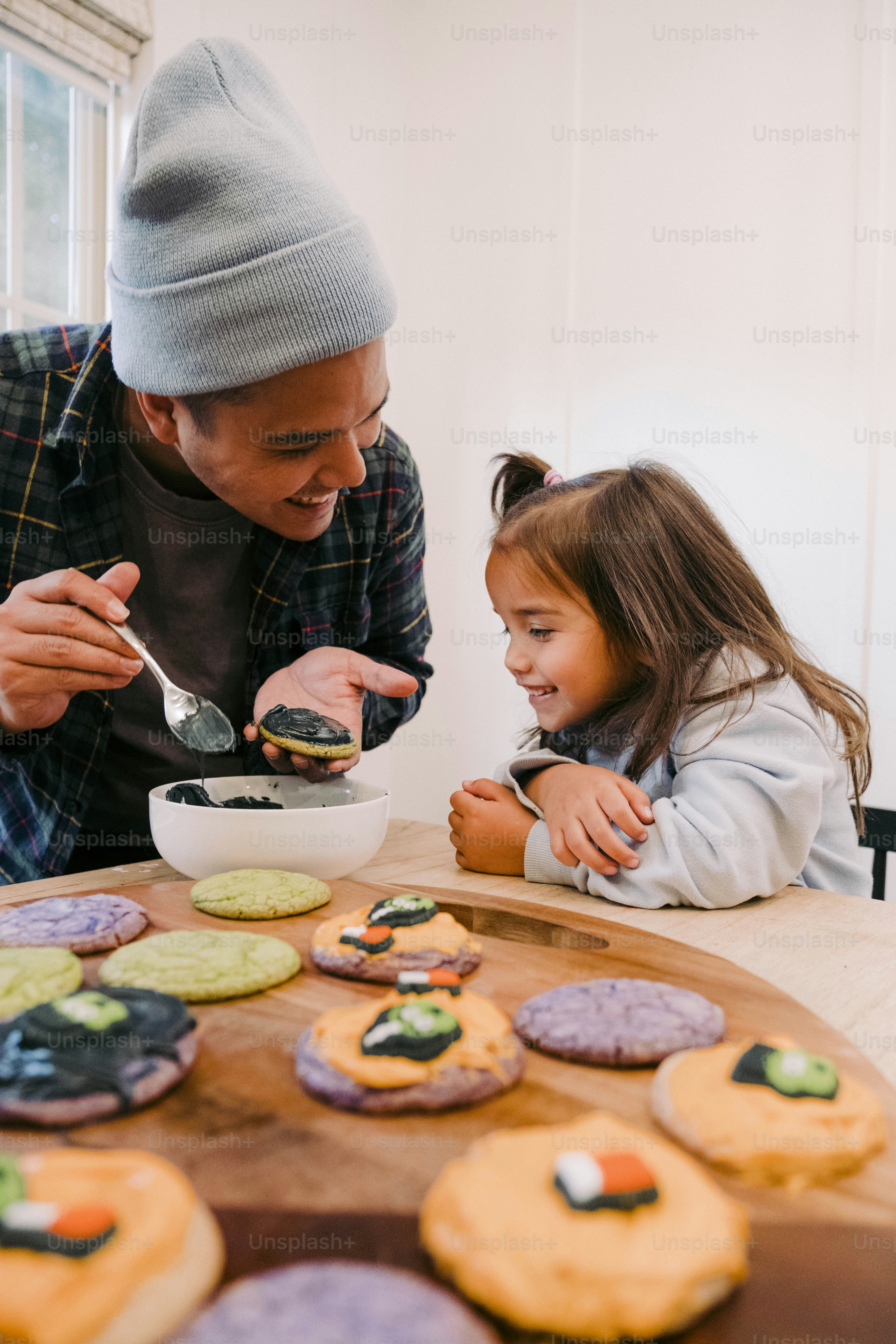 a man and a little girl sitting at a table