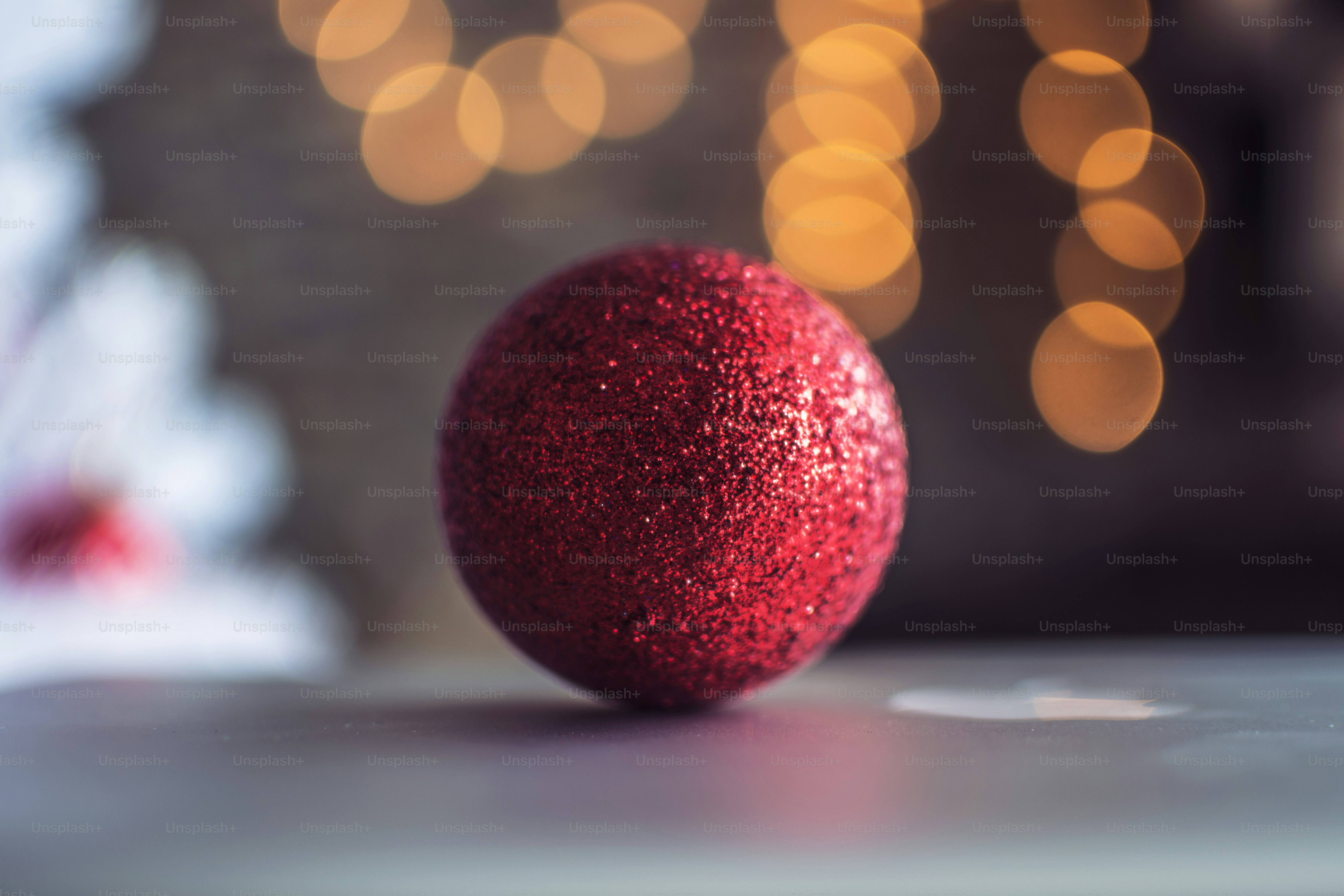 a red ball sitting on top of a table