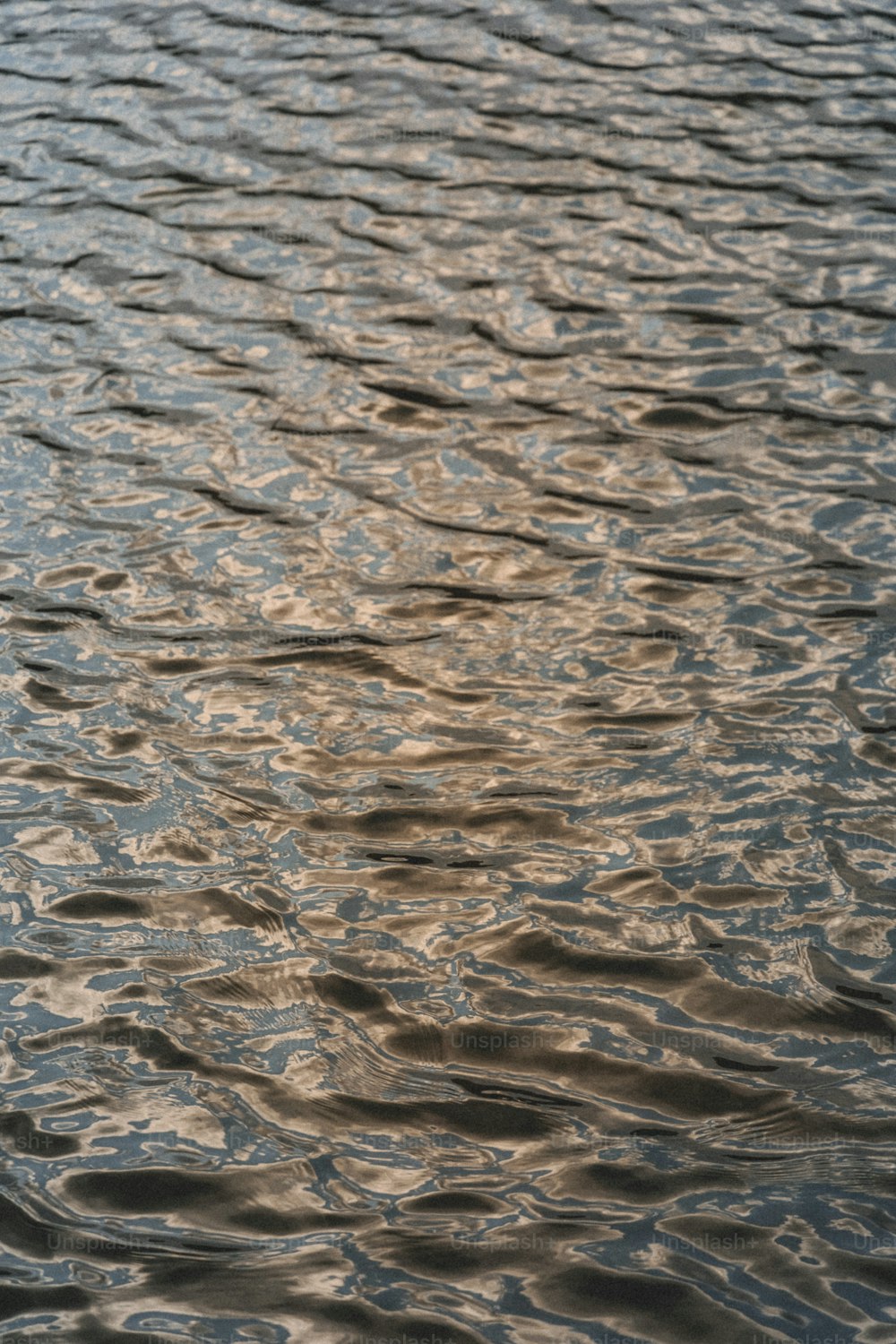 a large body of water with ripples on it