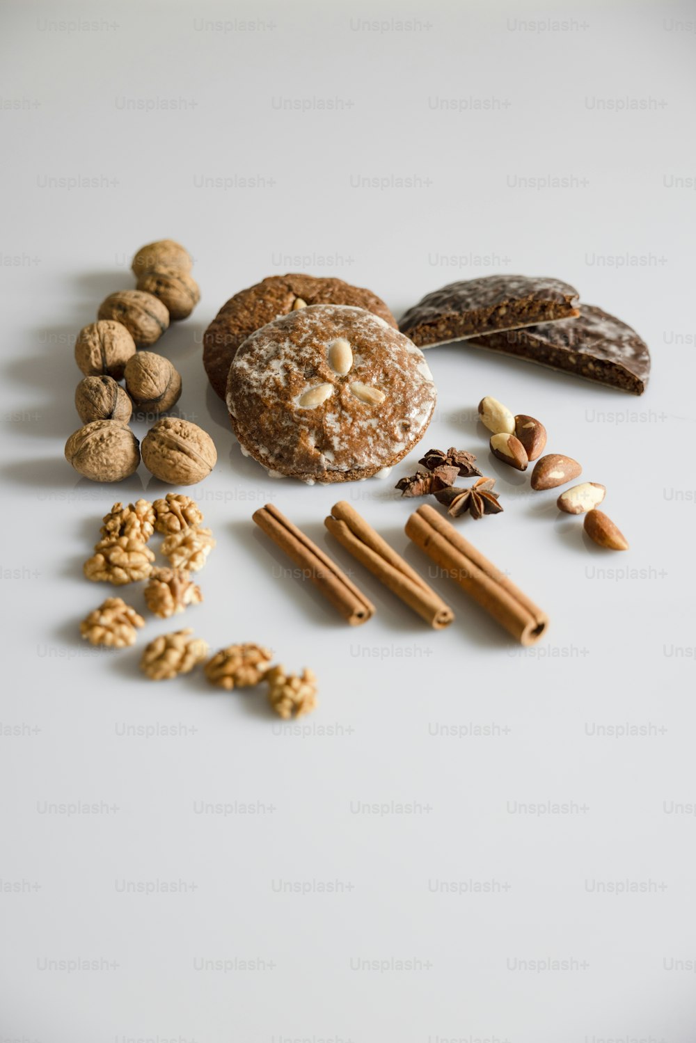 a variety of nuts and nutshells on a white surface