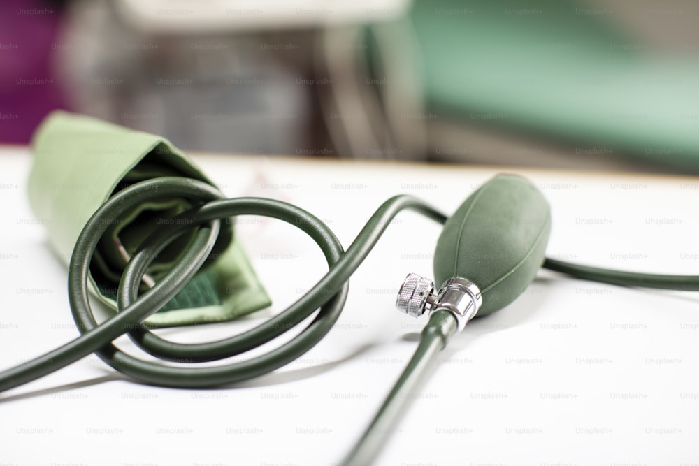 a close up of a green cord on a table