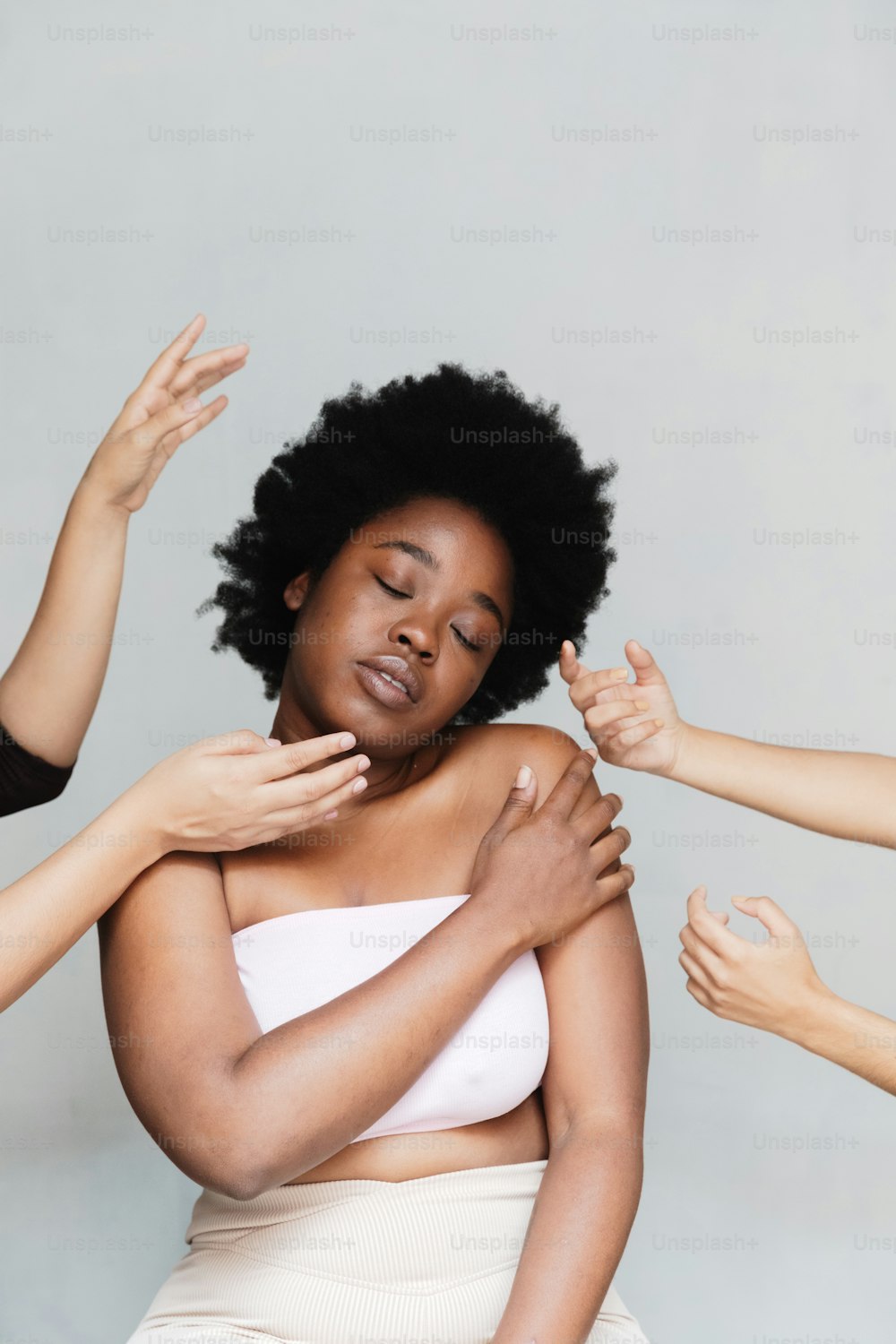 a woman with her arms around another woman