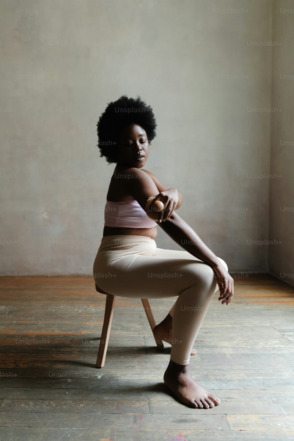 a woman sitting on a chair in a room