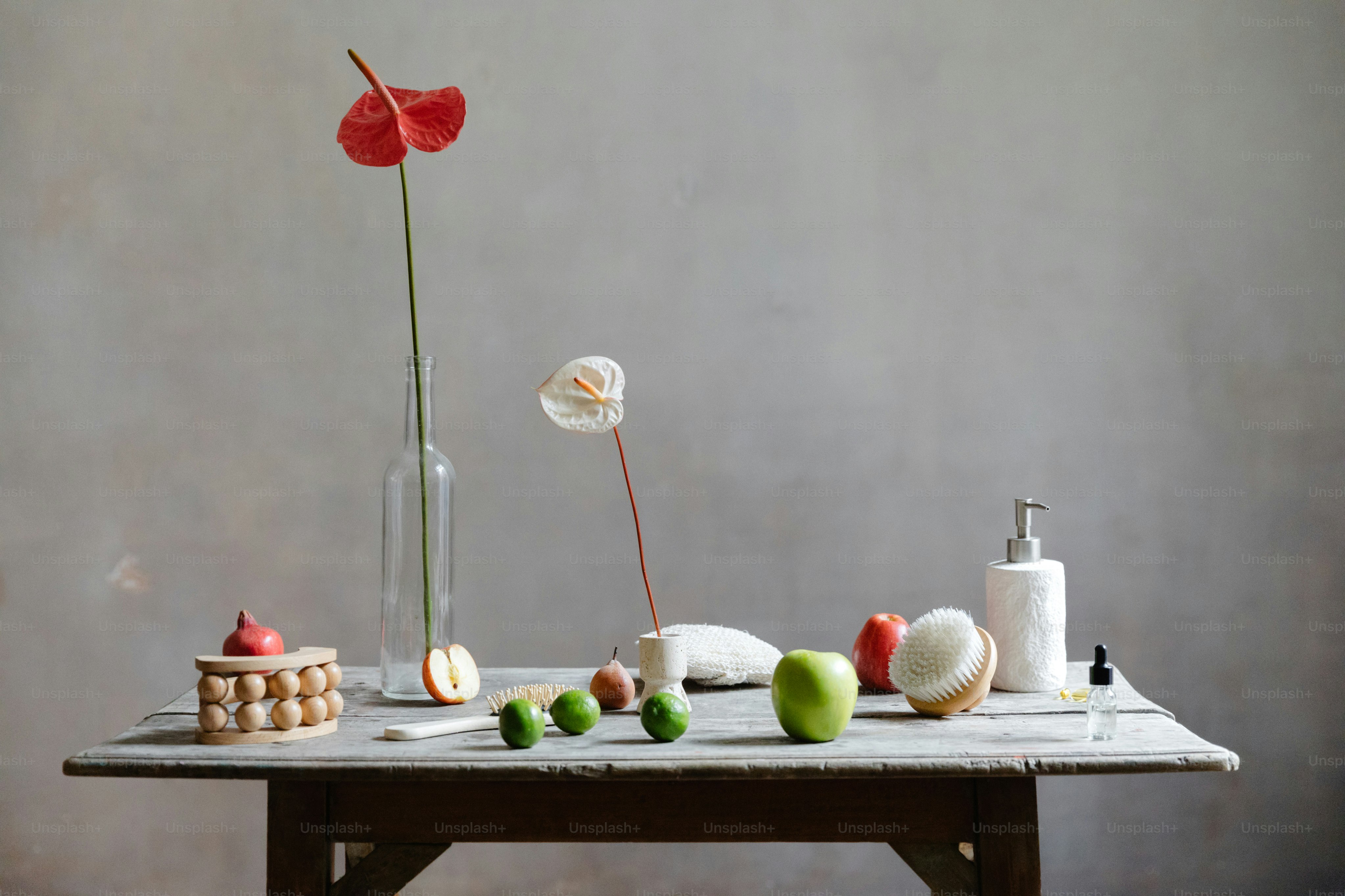 a wooden table topped with a vase filled with flowers