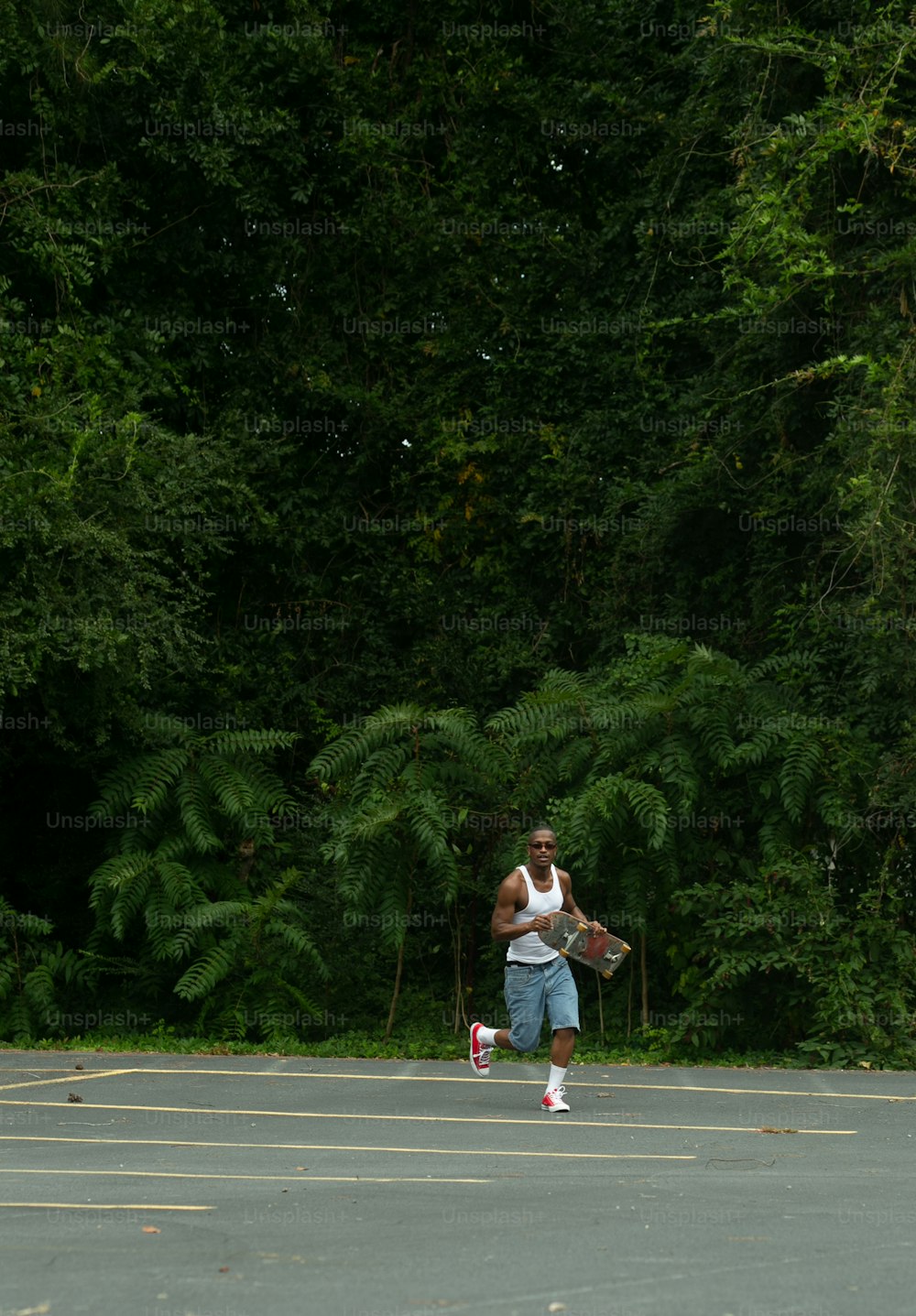 a man holding a tennis racquet on top of a tennis court