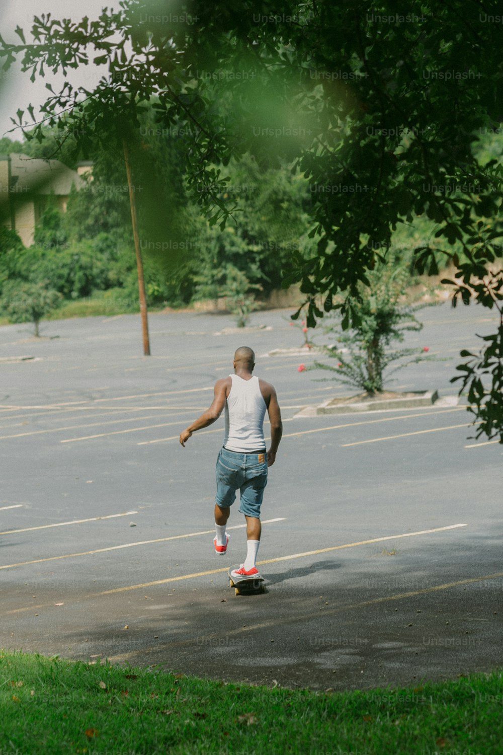 a man riding a skateboard down a street