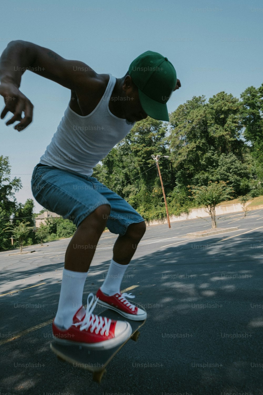 a man riding a skateboard down the side of a road