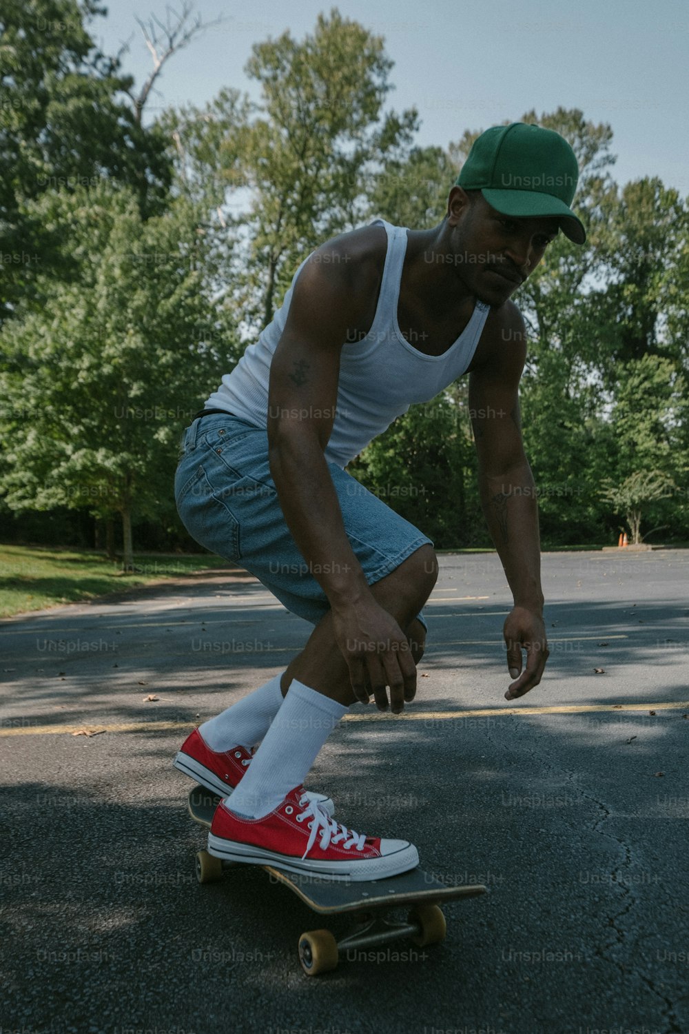 a man riding a skateboard down a street