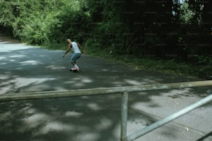 a man riding a skateboard down a street