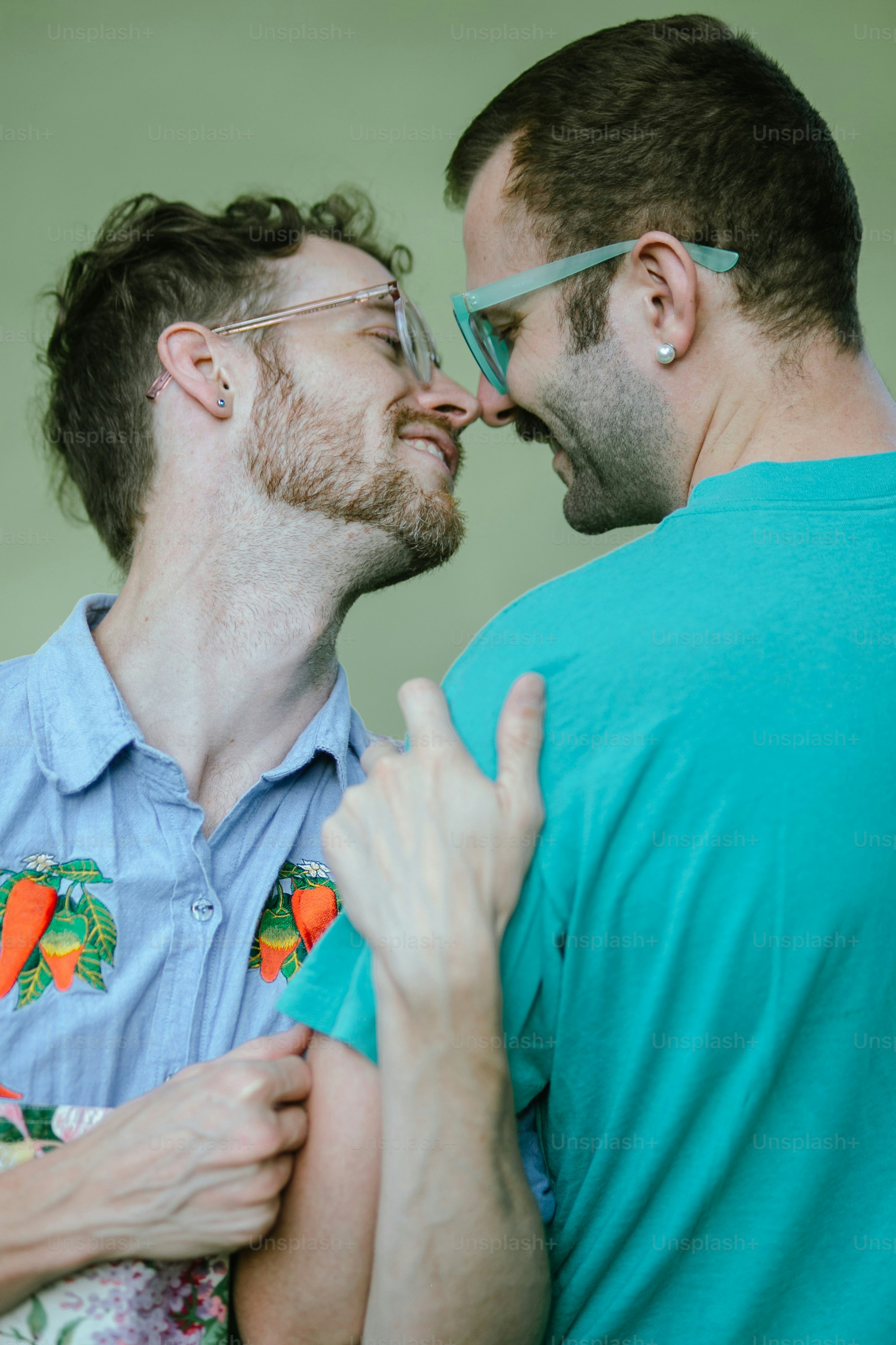 a couple of men standing next to each other