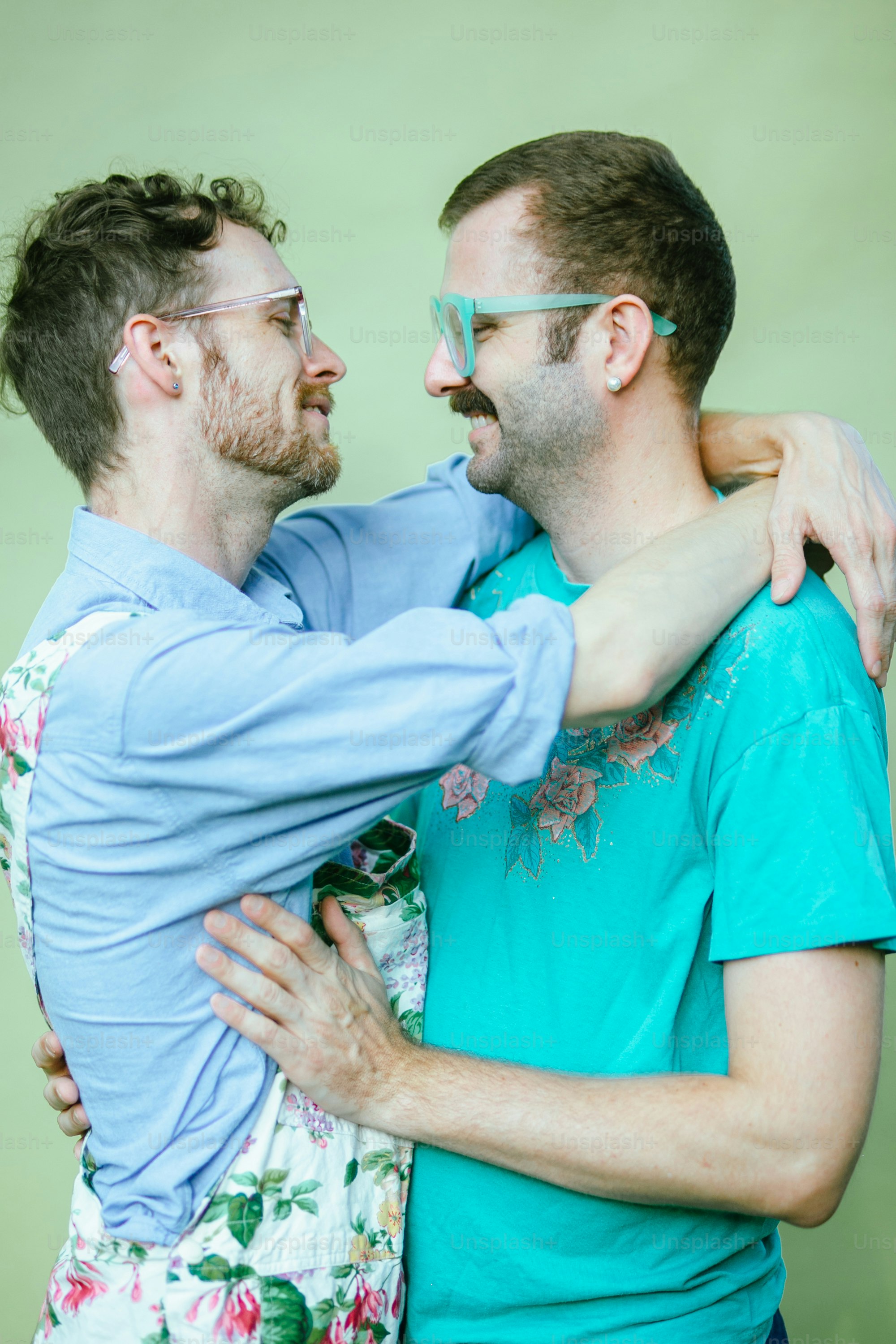 a couple of men hugging each other