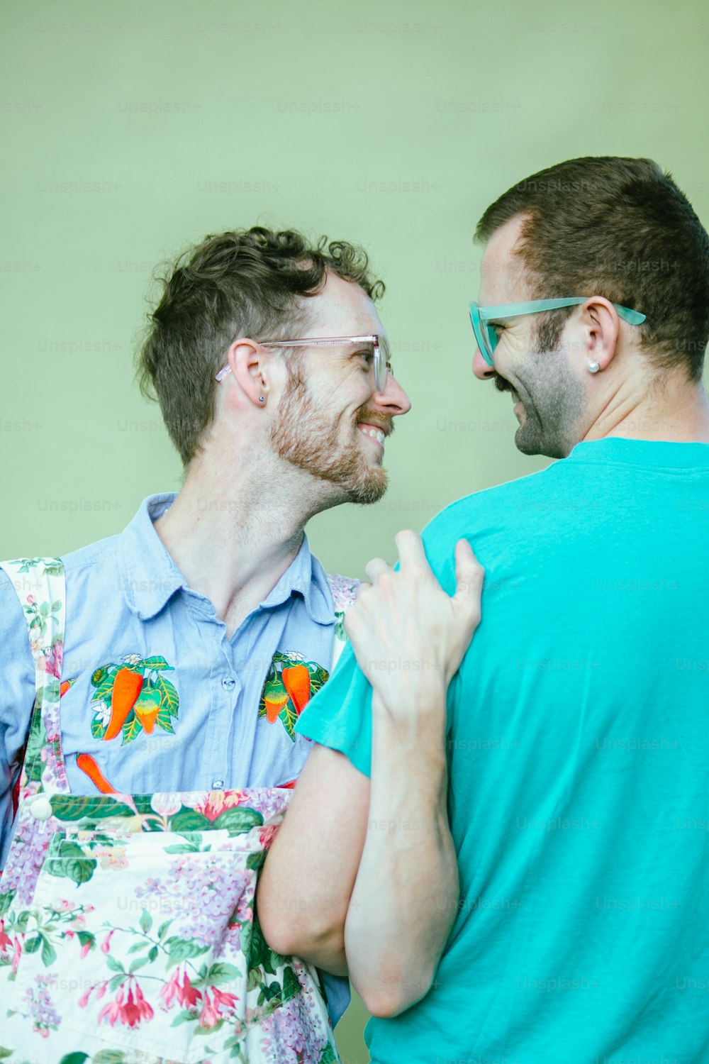 a couple of men standing next to each other