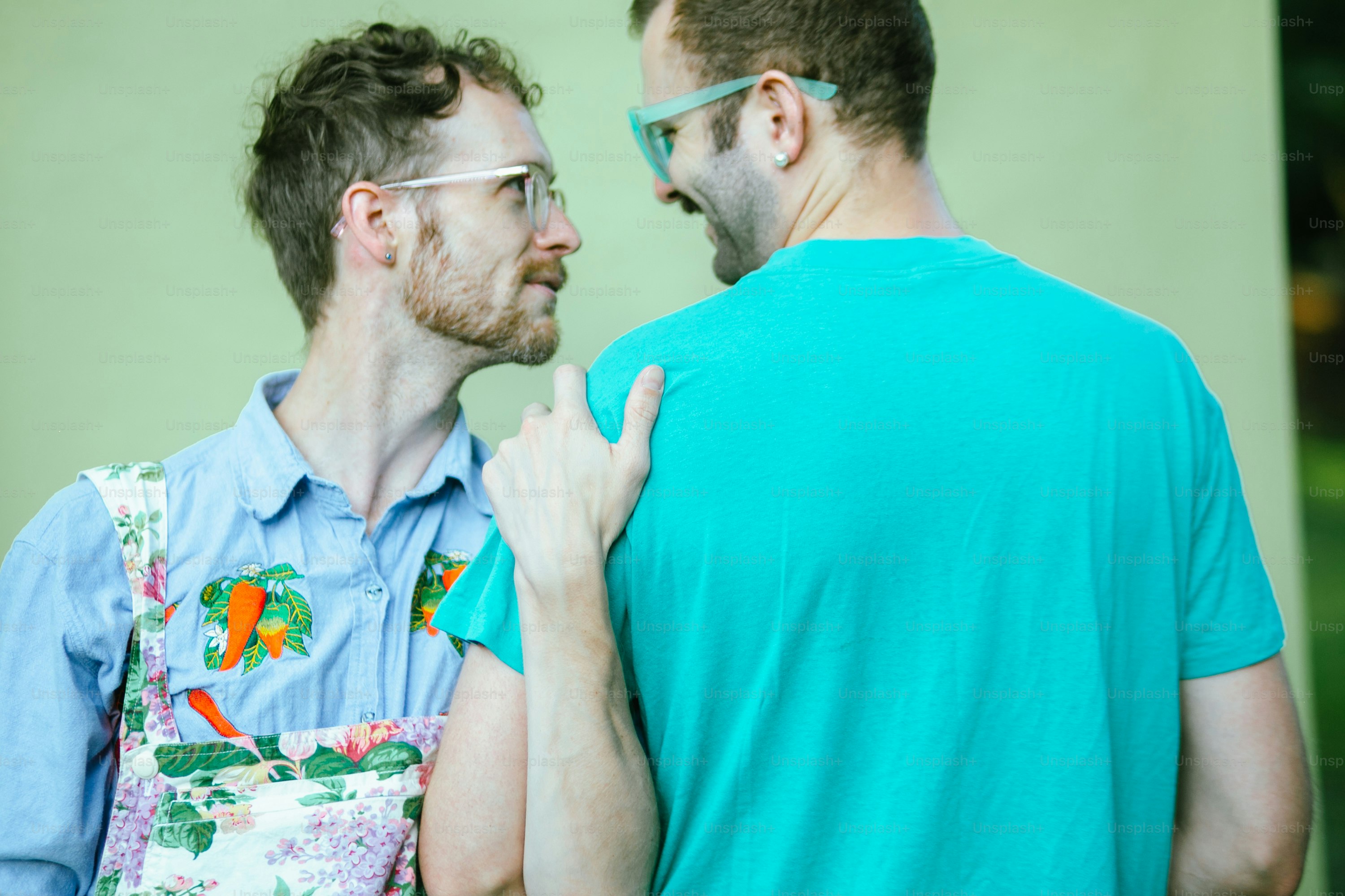 a couple of men standing next to each other