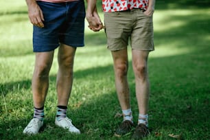 a couple of people that are standing in the grass