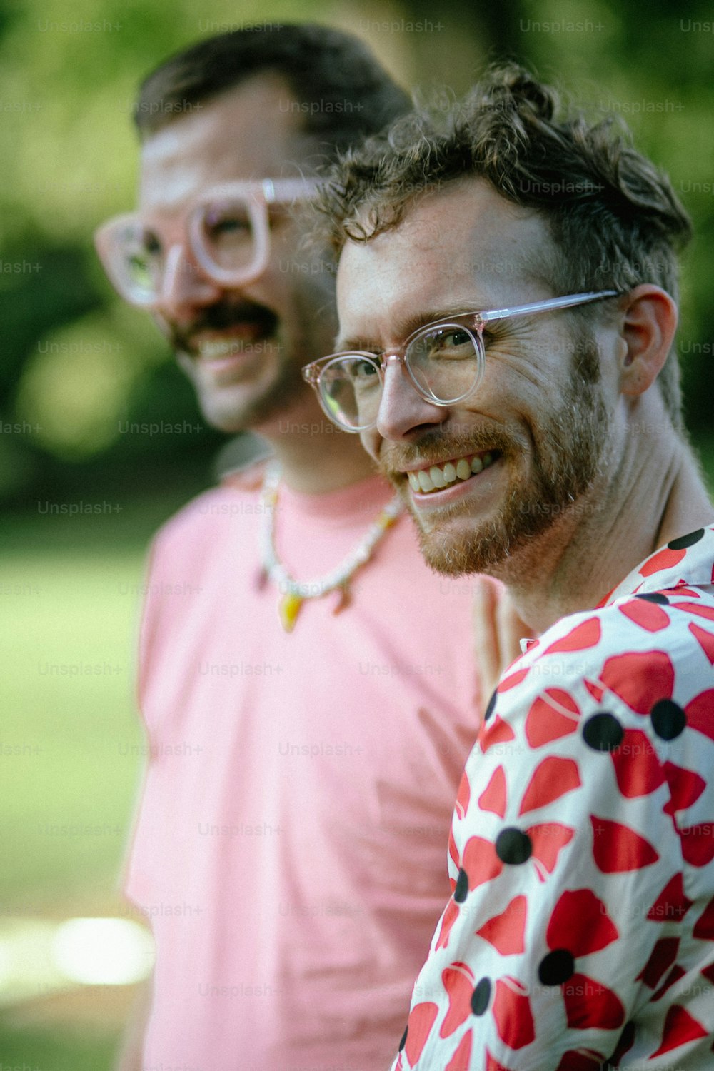 a couple of men standing next to each other