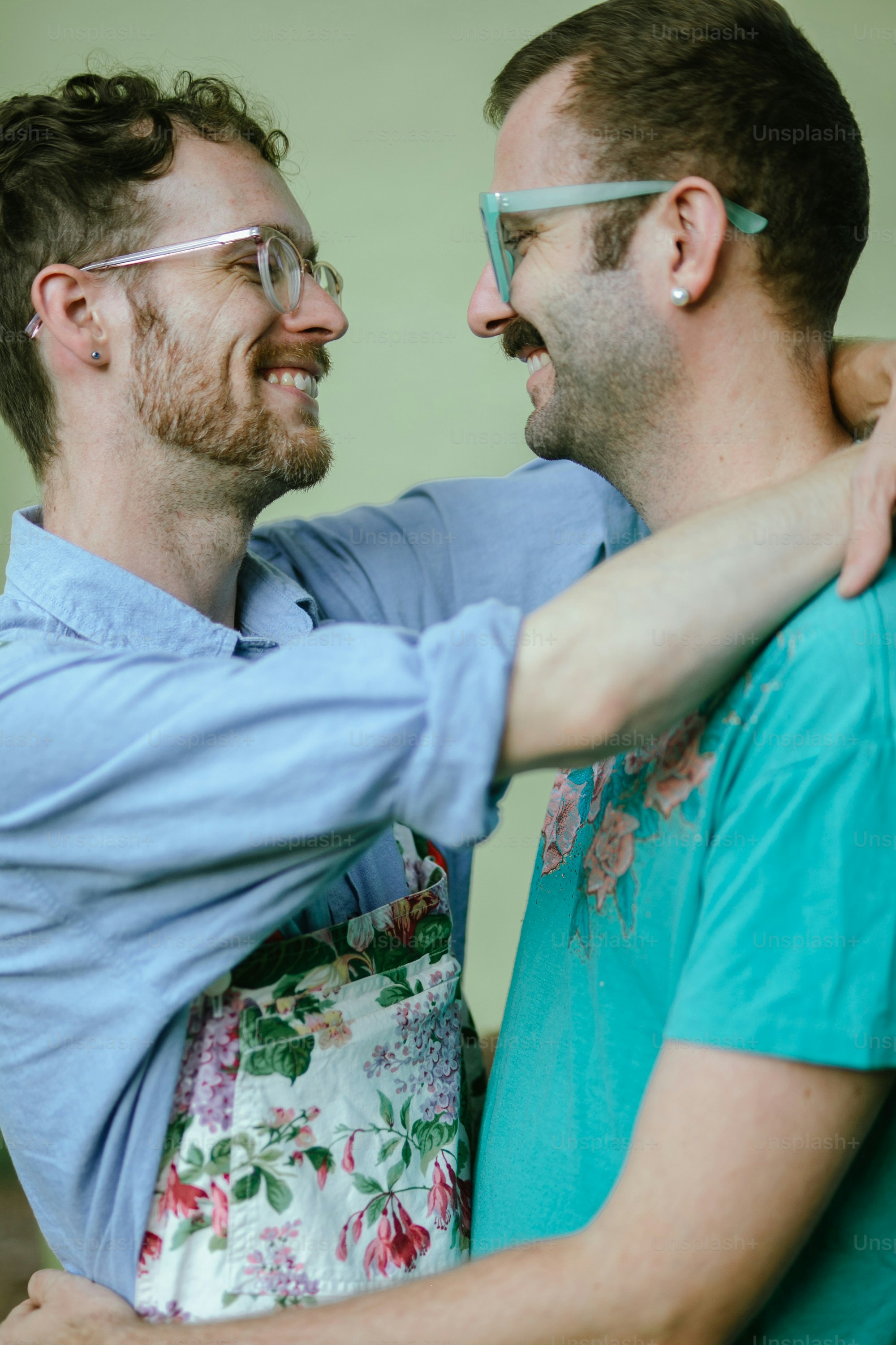 a couple of men standing next to each other