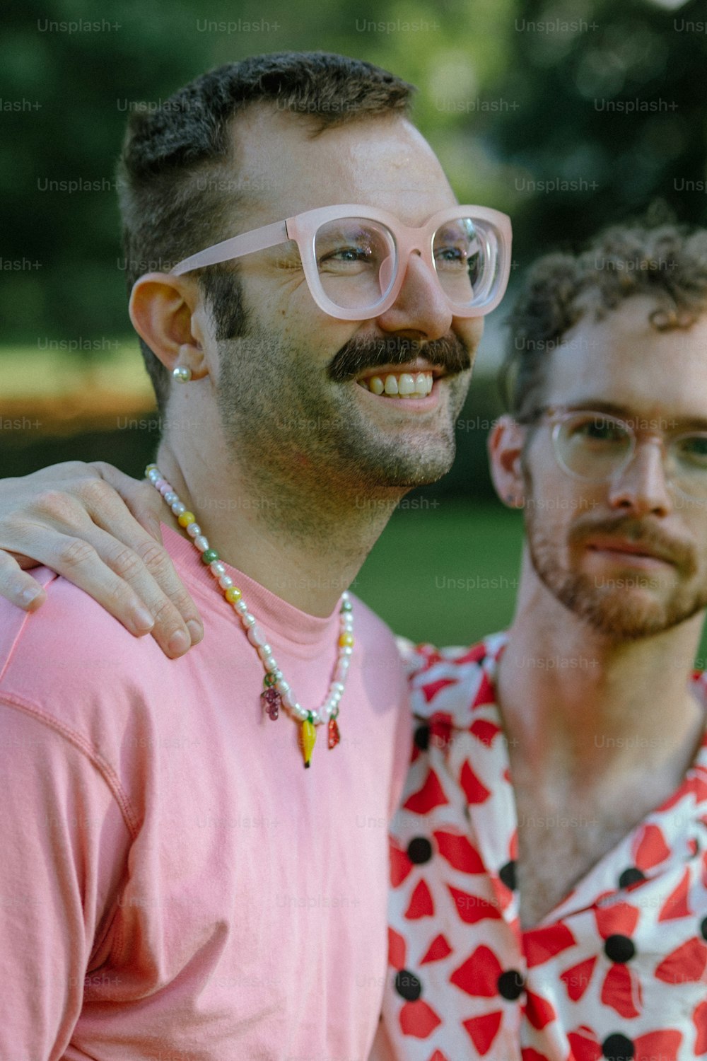 a couple of men standing next to each other