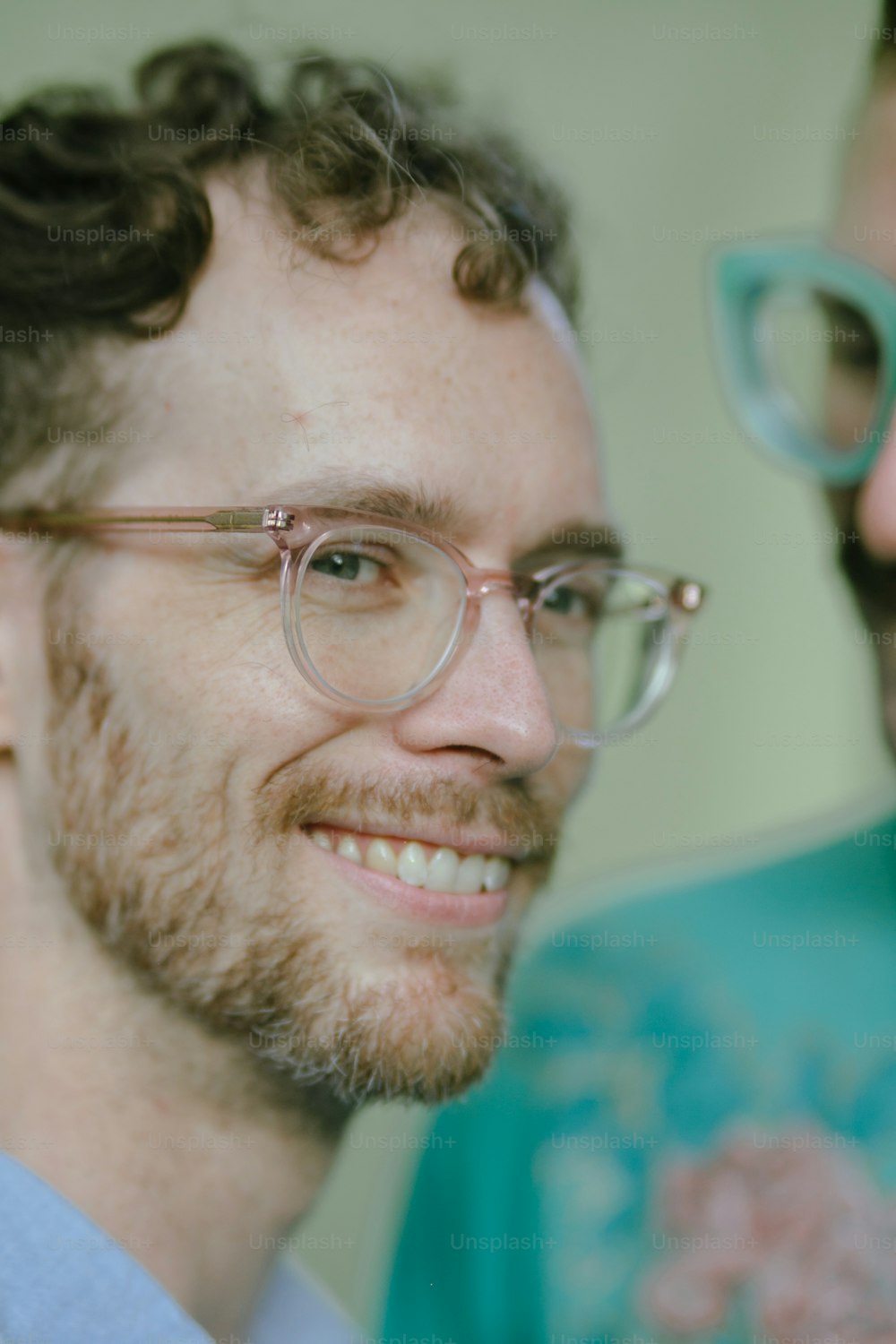 a close up of a person wearing glasses