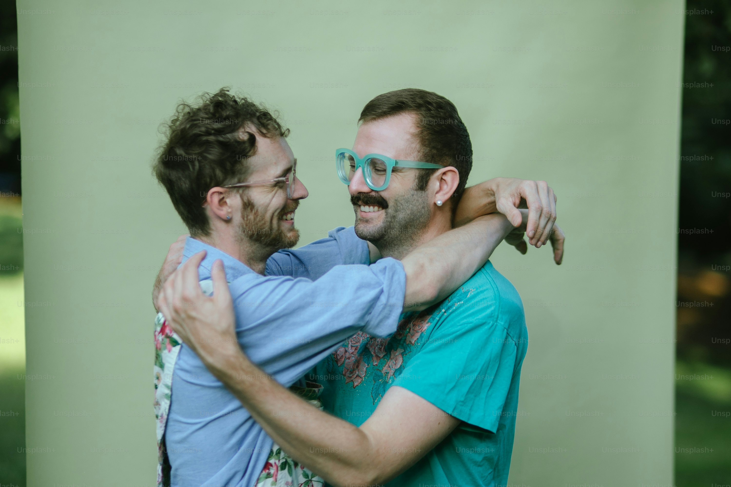 a couple of men standing next to each other